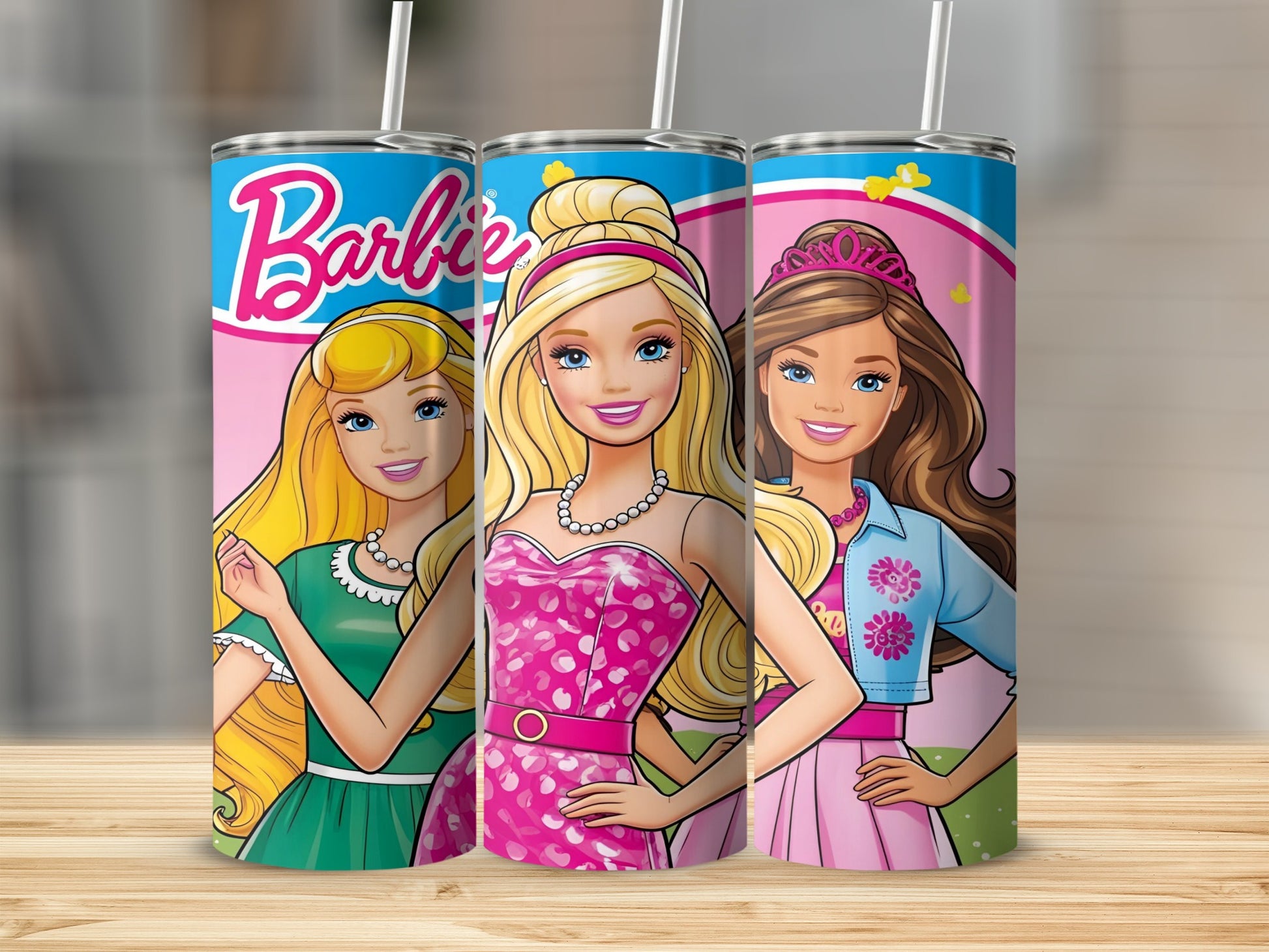 Three Barbie dolls in colorful dresses and accessories on tumblers.