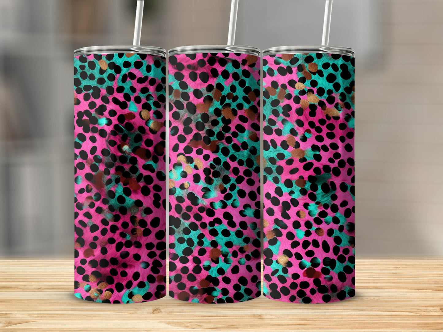 Pink, teal, and gold leopard print tumbler with straw.