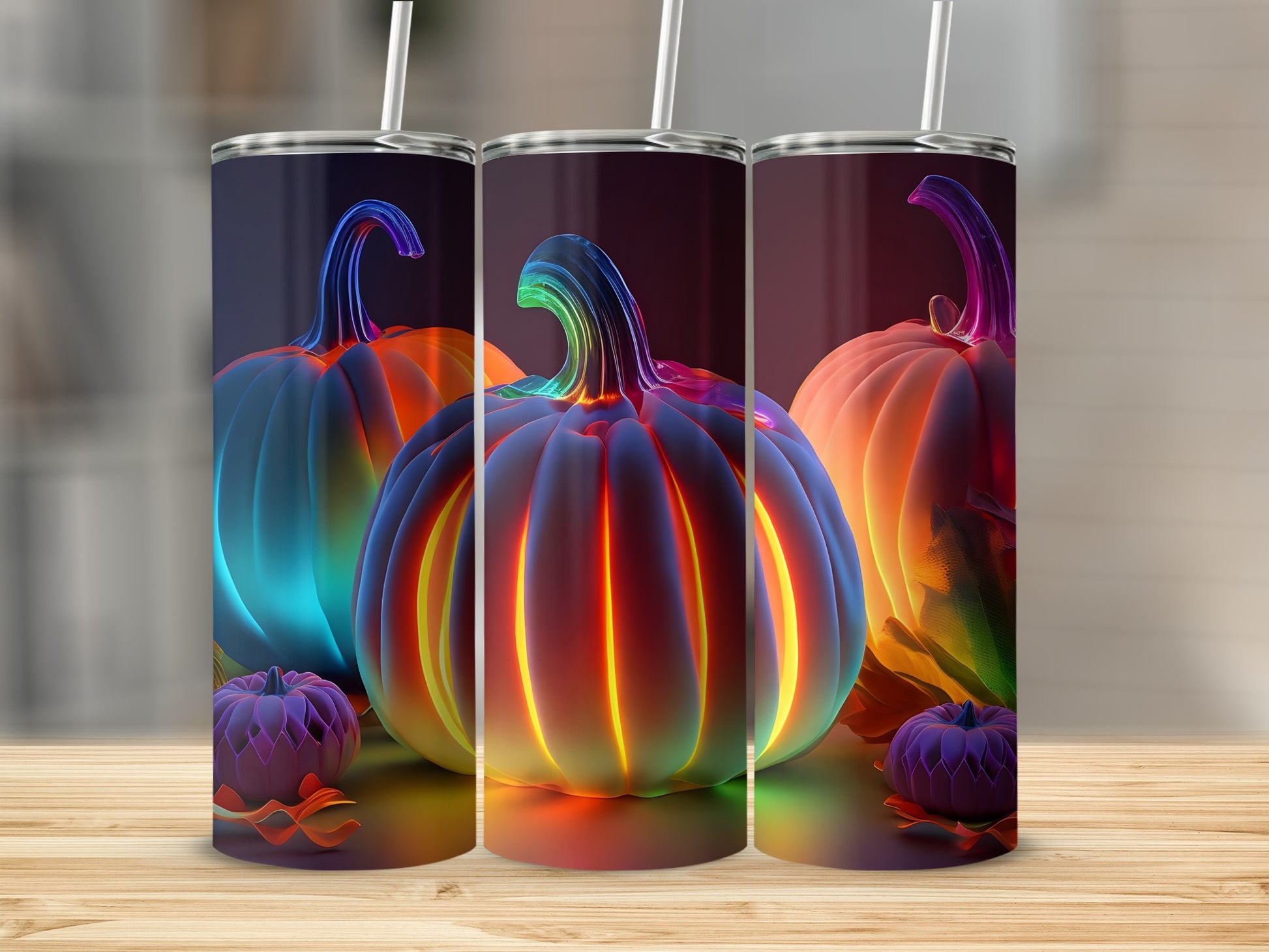 Three glowing, colorful pumpkins with straws on a wooden surface.