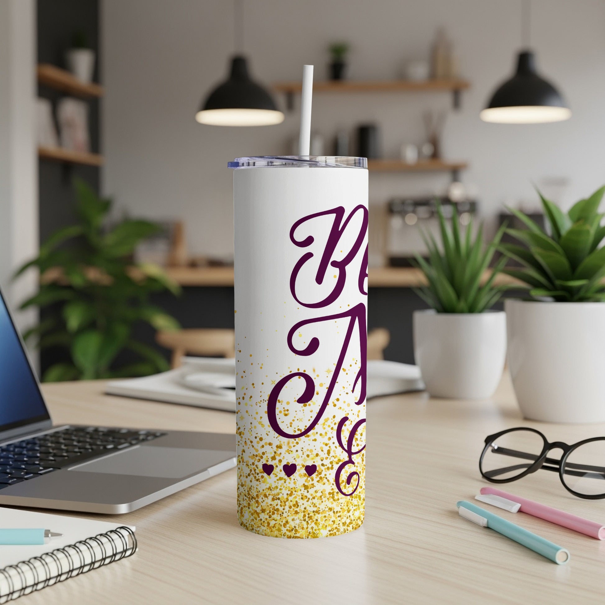 White tumbler with "Best Auntie" in purple script and gold glitter.