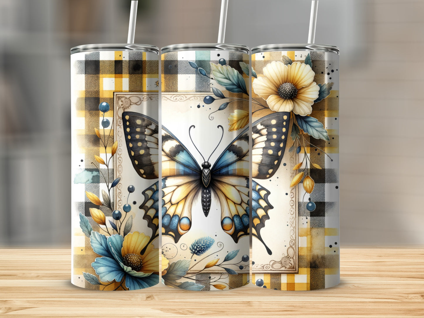 Two stainless steel tumblers with butterfly and floral designs on plaid backgrounds.
