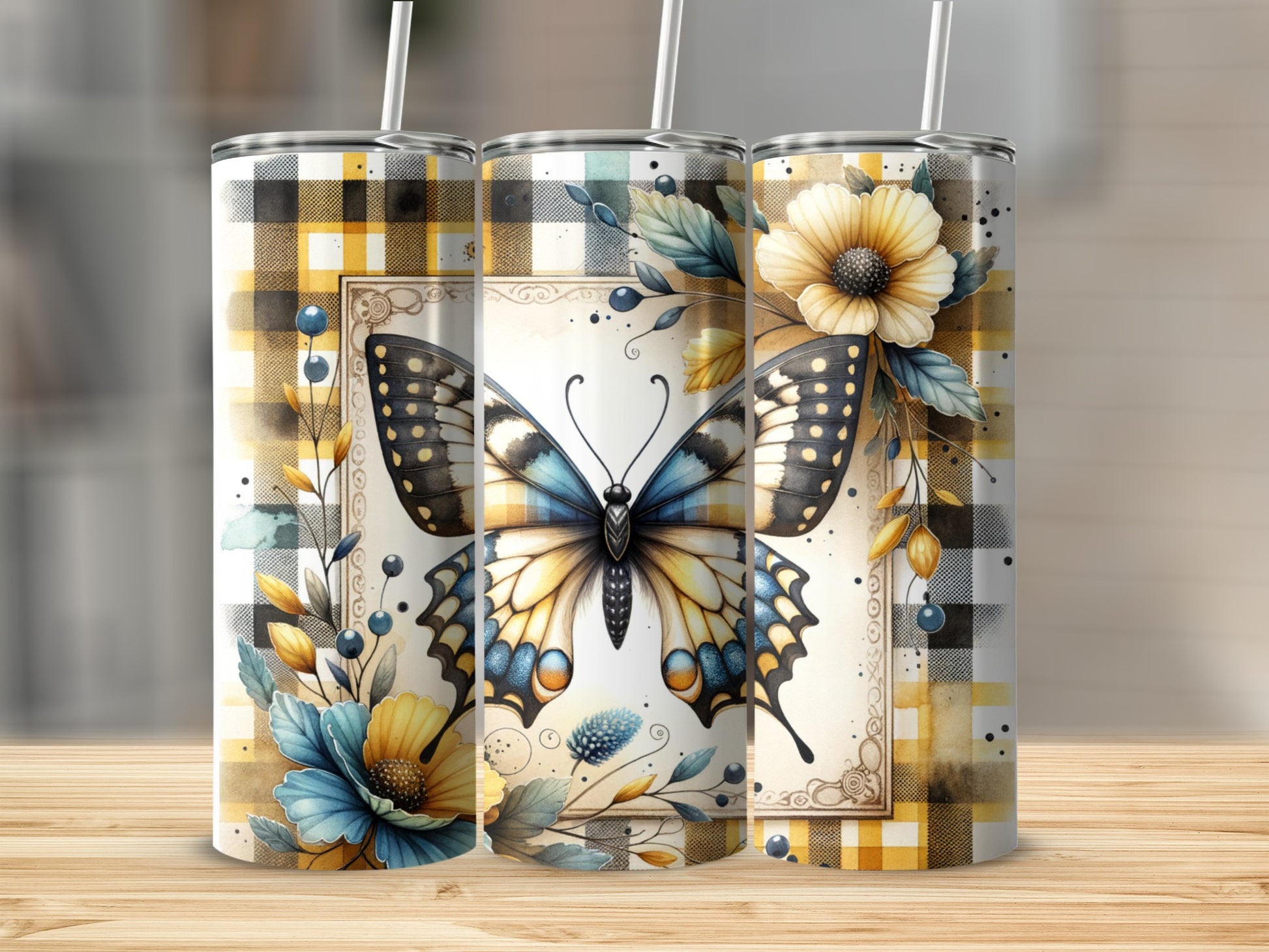 Two stainless steel tumblers with butterfly and floral designs on plaid backgrounds.