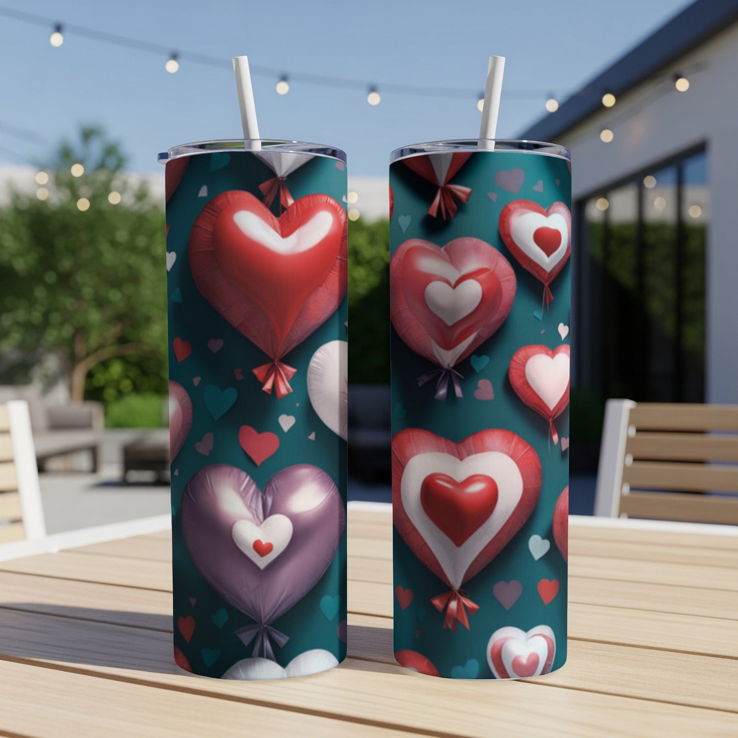 Two tall tumblers with a teal background and a pattern of red and pink heart balloons.
