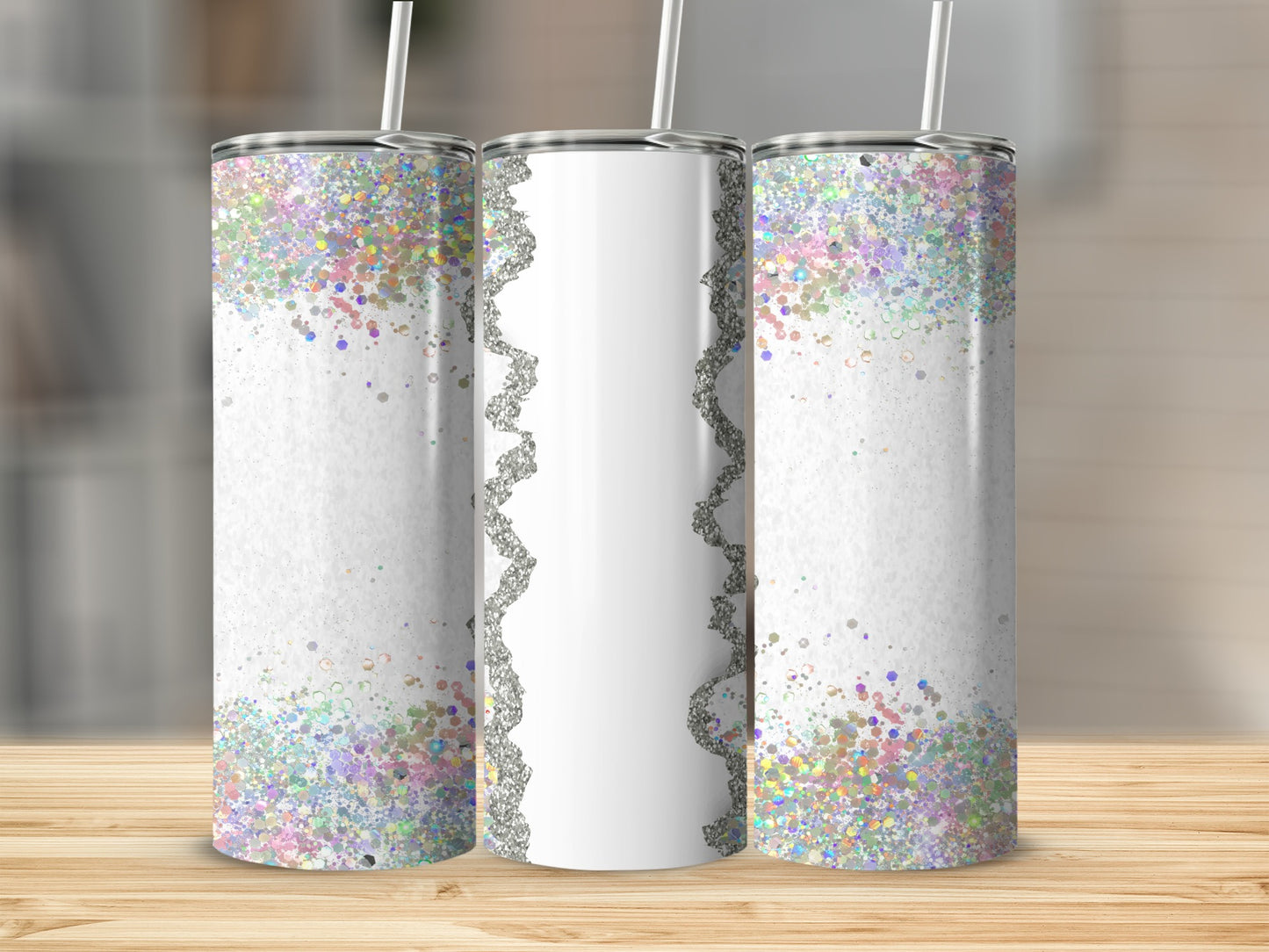 Three glittery tumblers with white lace trim on a wooden surface.