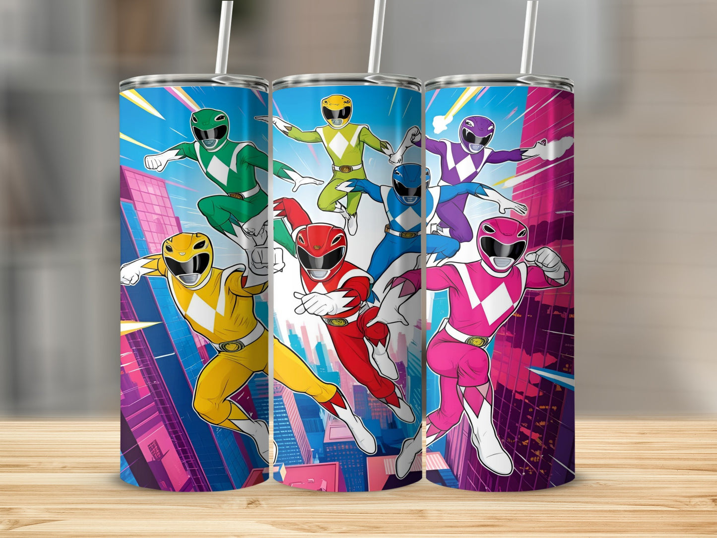 Three Power Rangers tumblers with city skyline background.
