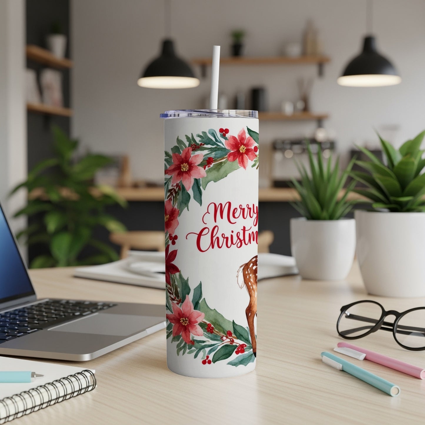 White tumbler with deer, poinsettias, and "Merry Christmas" text.