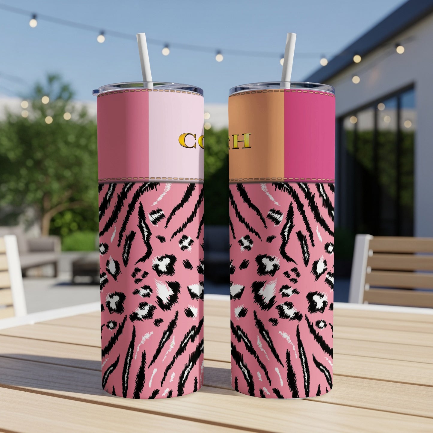 Two pink tumblers with tiger stripe and leopard print patterns and gold lettering.