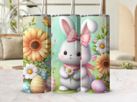 Easter bunny with sunflowers, daisies, and painted eggs on a tumbler.