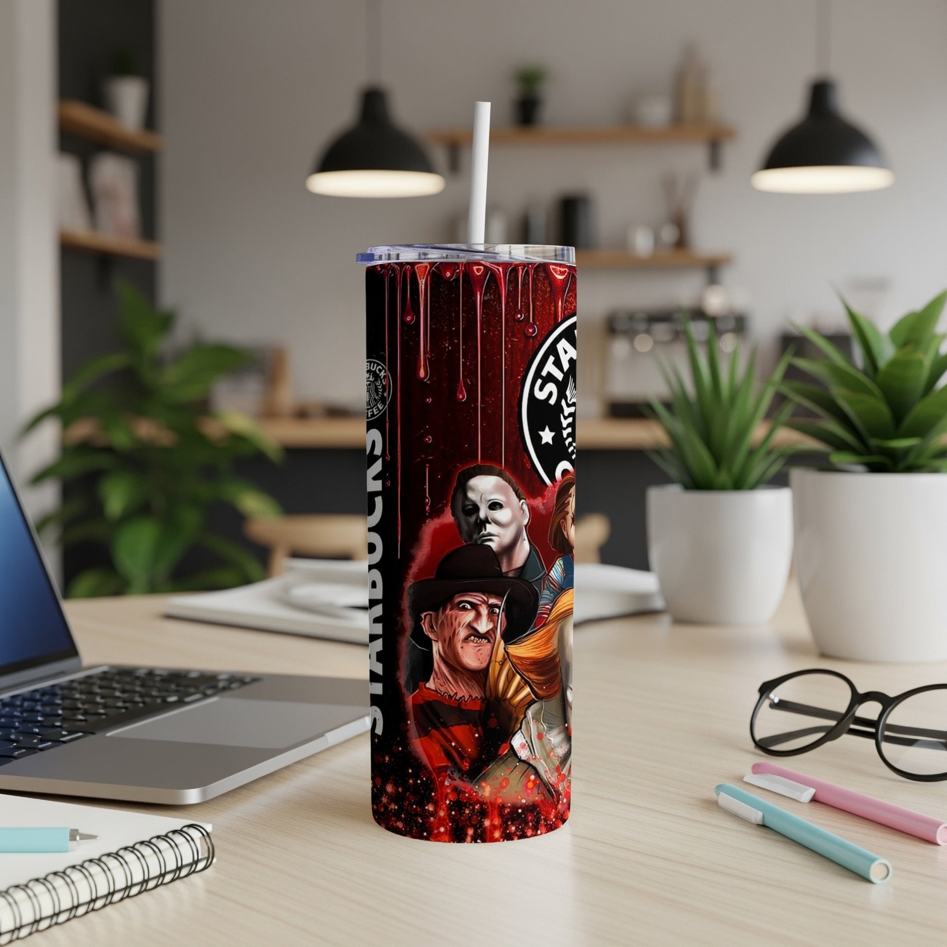 Horror movie characters on a Starbucks-themed tumbler with a straw.