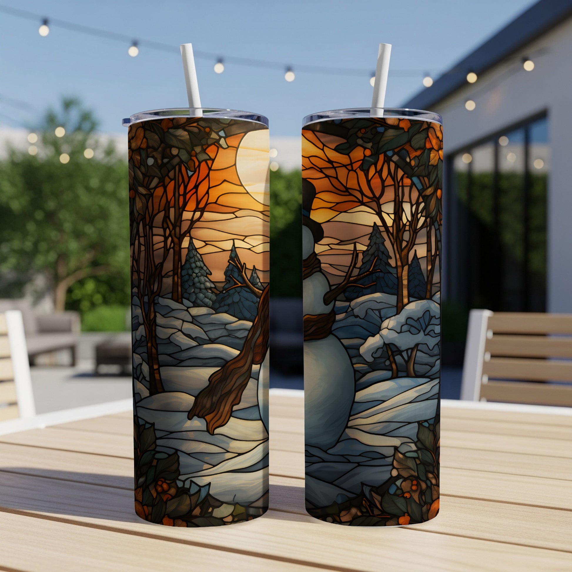 Two stained-glass style tumblers depicting a snowy winter scene with a snowman.
