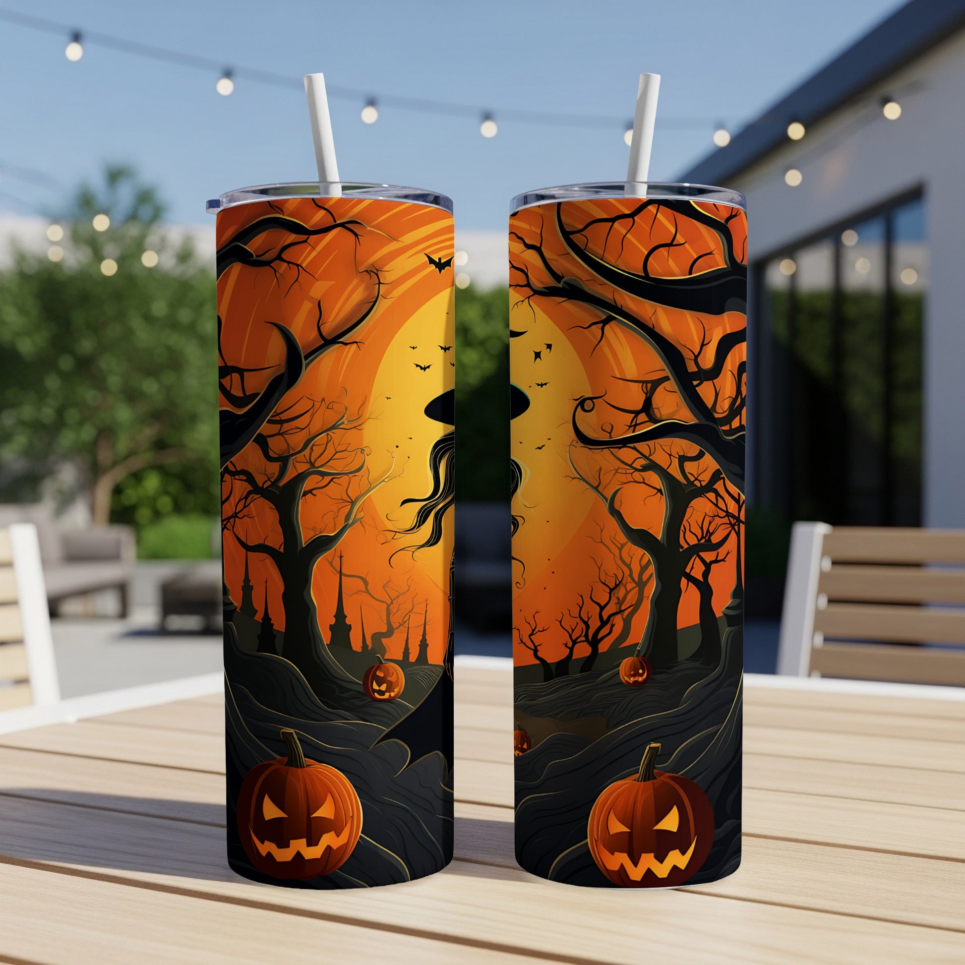Two Halloween-themed tumblers with a witch and jack-o'-lanterns design.