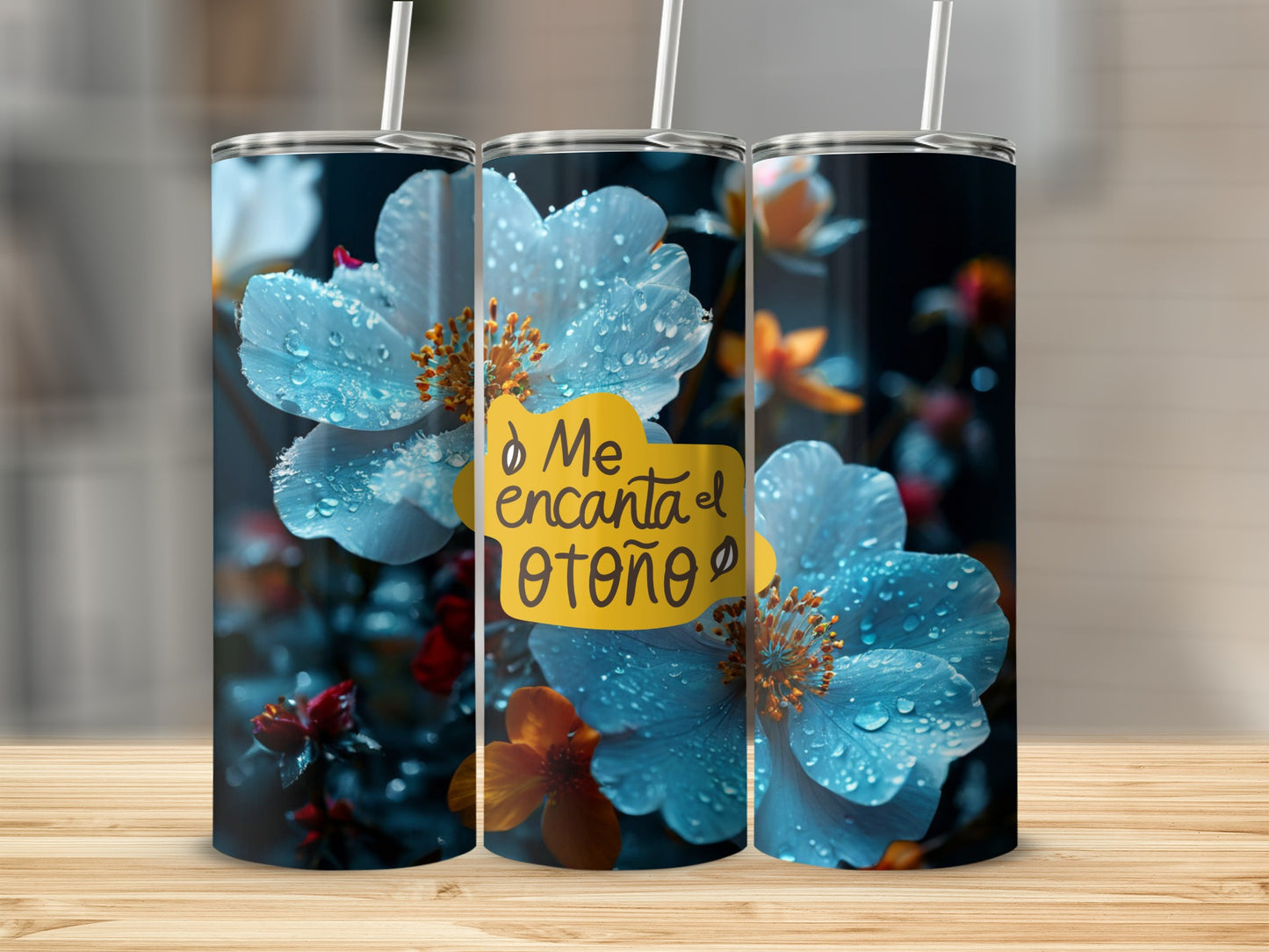 Tumbler with close-up of blue flowers and "Me encanta el otoño" text.