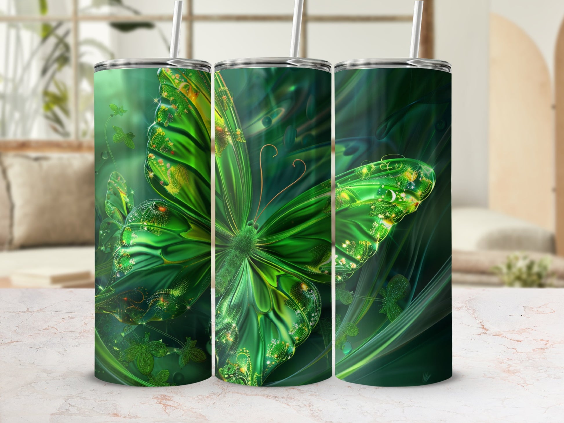 Green butterfly design on three tumblers with straws.