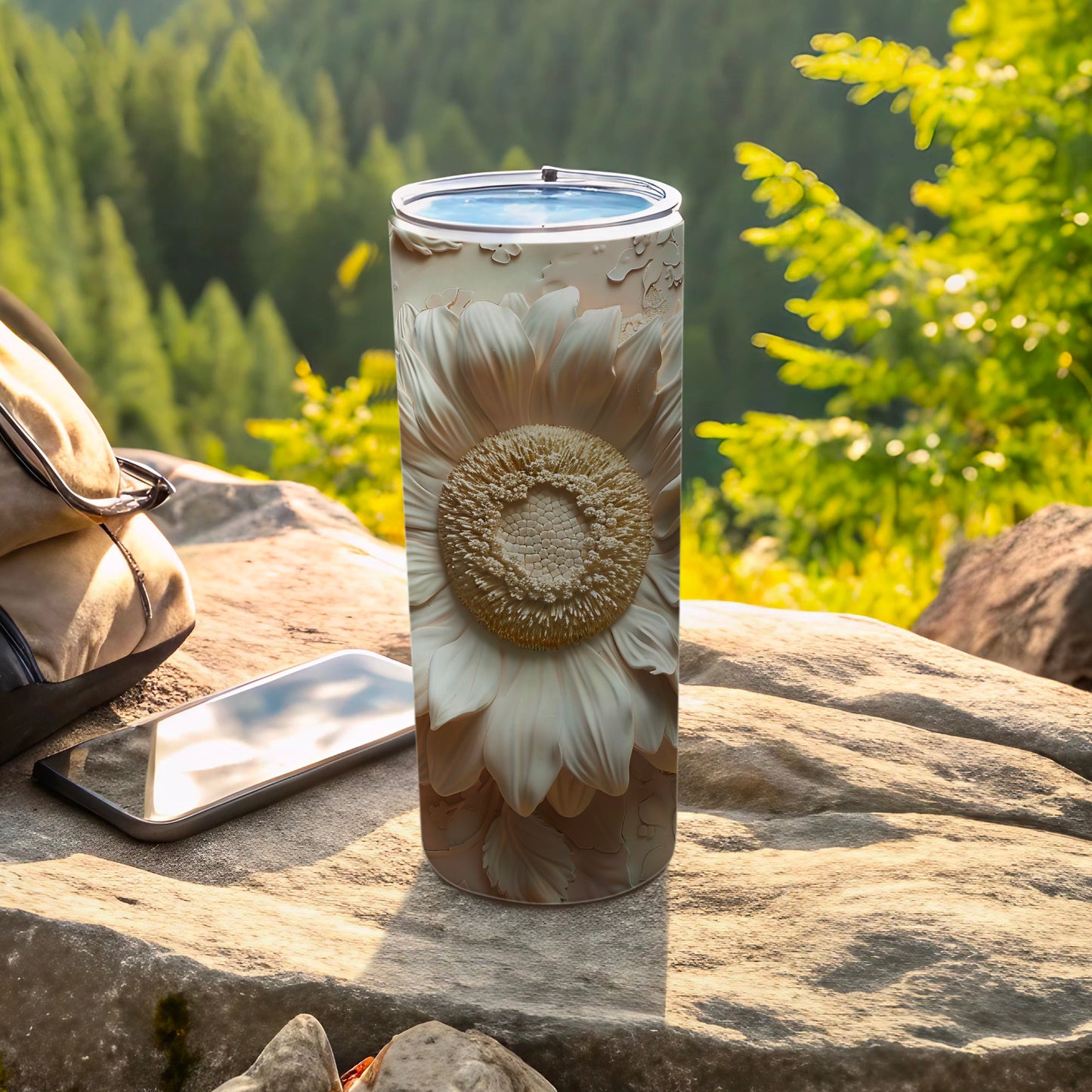 White embossed sunflower pattern on a cylindrical tumbler.
