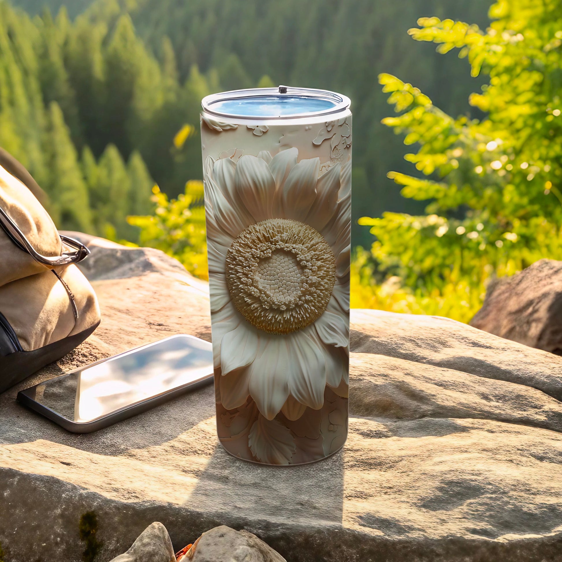White embossed sunflower pattern on a cylindrical tumbler.