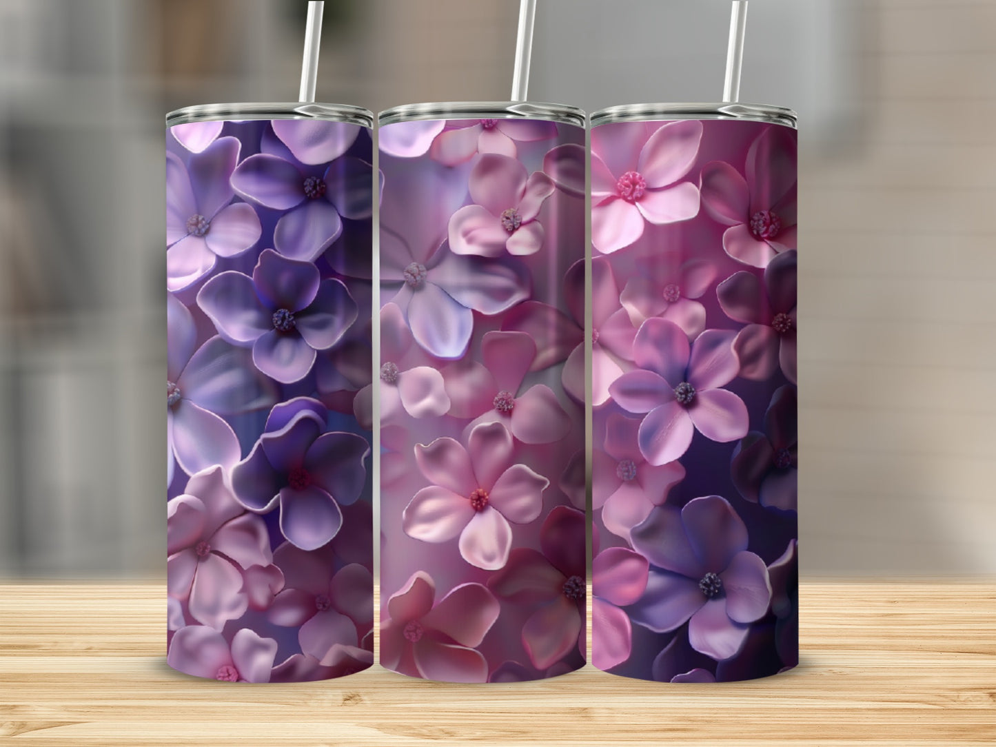 Three tumblers with a floral pattern of purple and pink flowers.