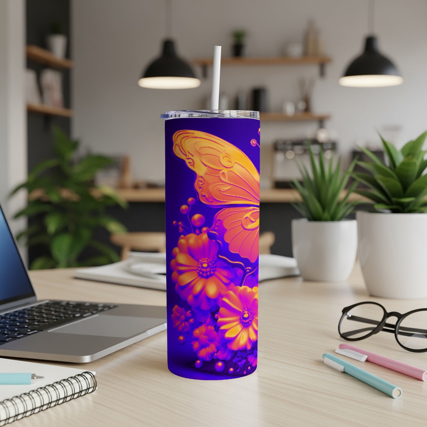 Purple tumbler with an orange butterfly and floral design.