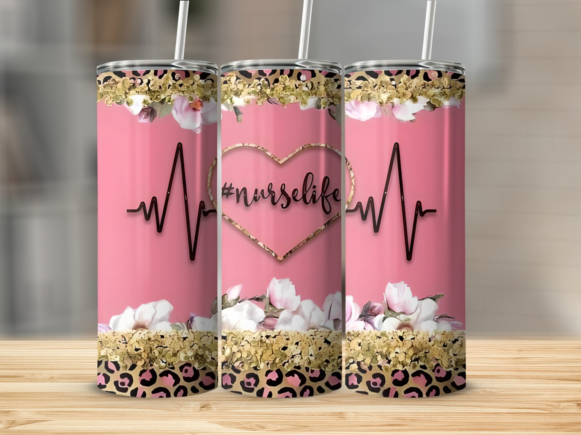 Pink tumbler with heartbeat, flowers, and "#nurselife" text.