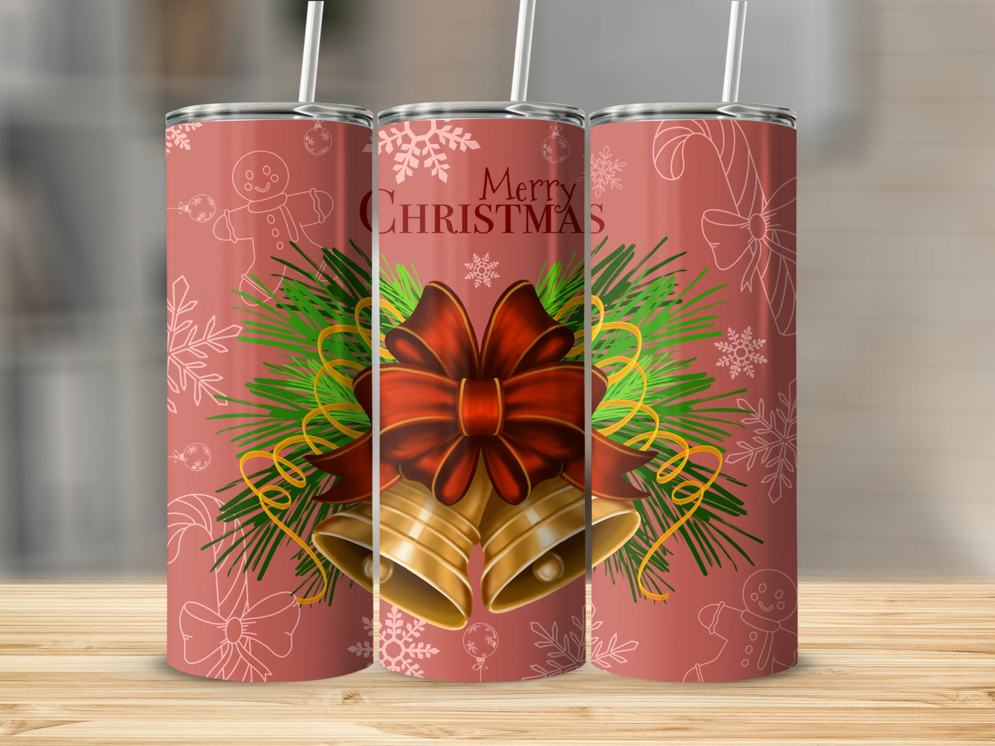 Red tumbler with Christmas bells, pine sprigs, bow, and snowflakes.