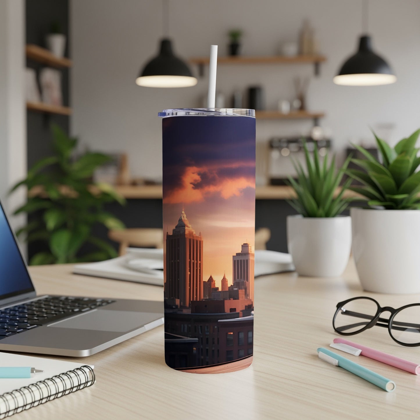 Tall buildings against a colorful sunset sky, on a tumbler.