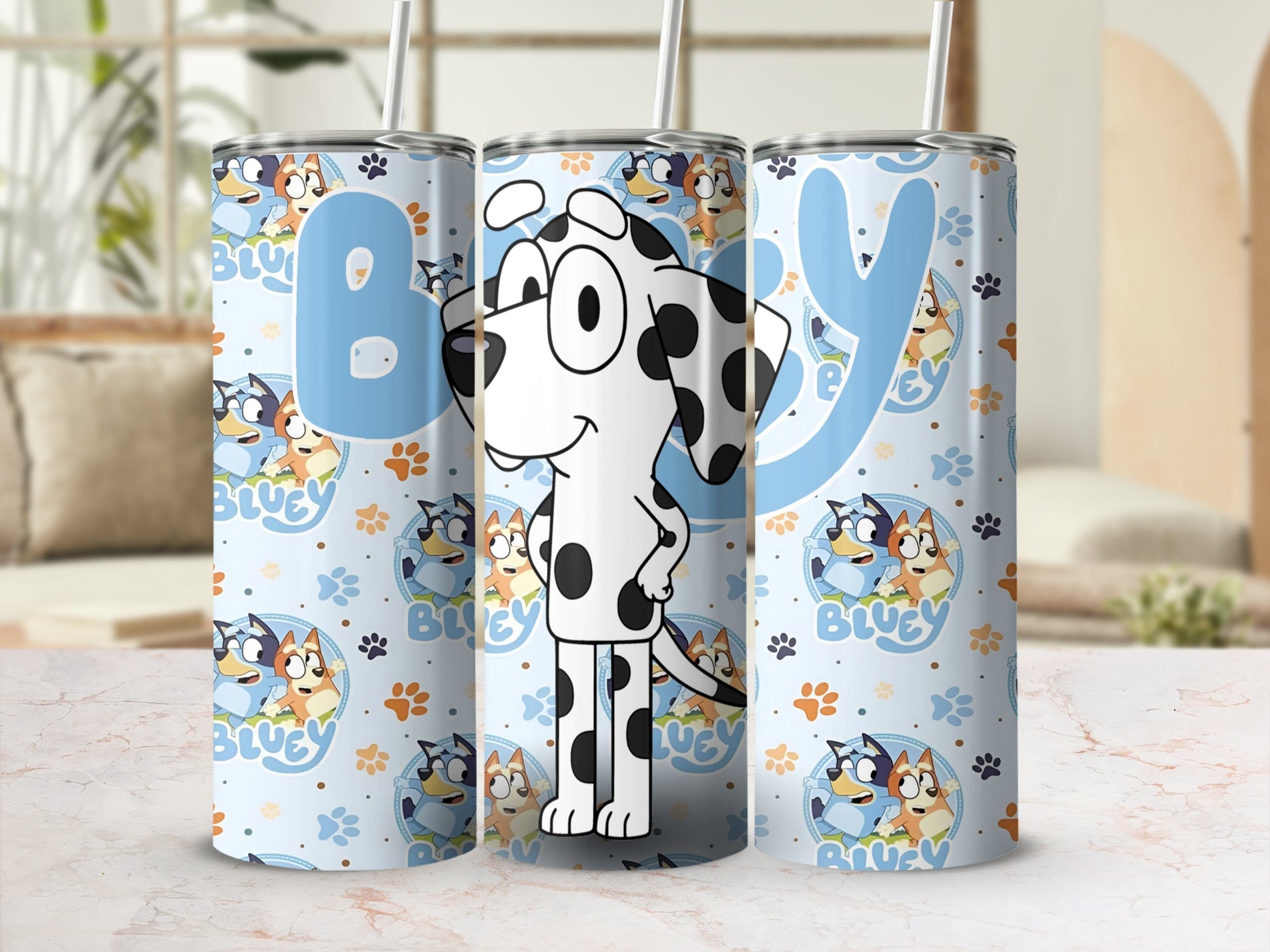 Bluey character tumbler with polka dots and repeating Bluey dog designs.