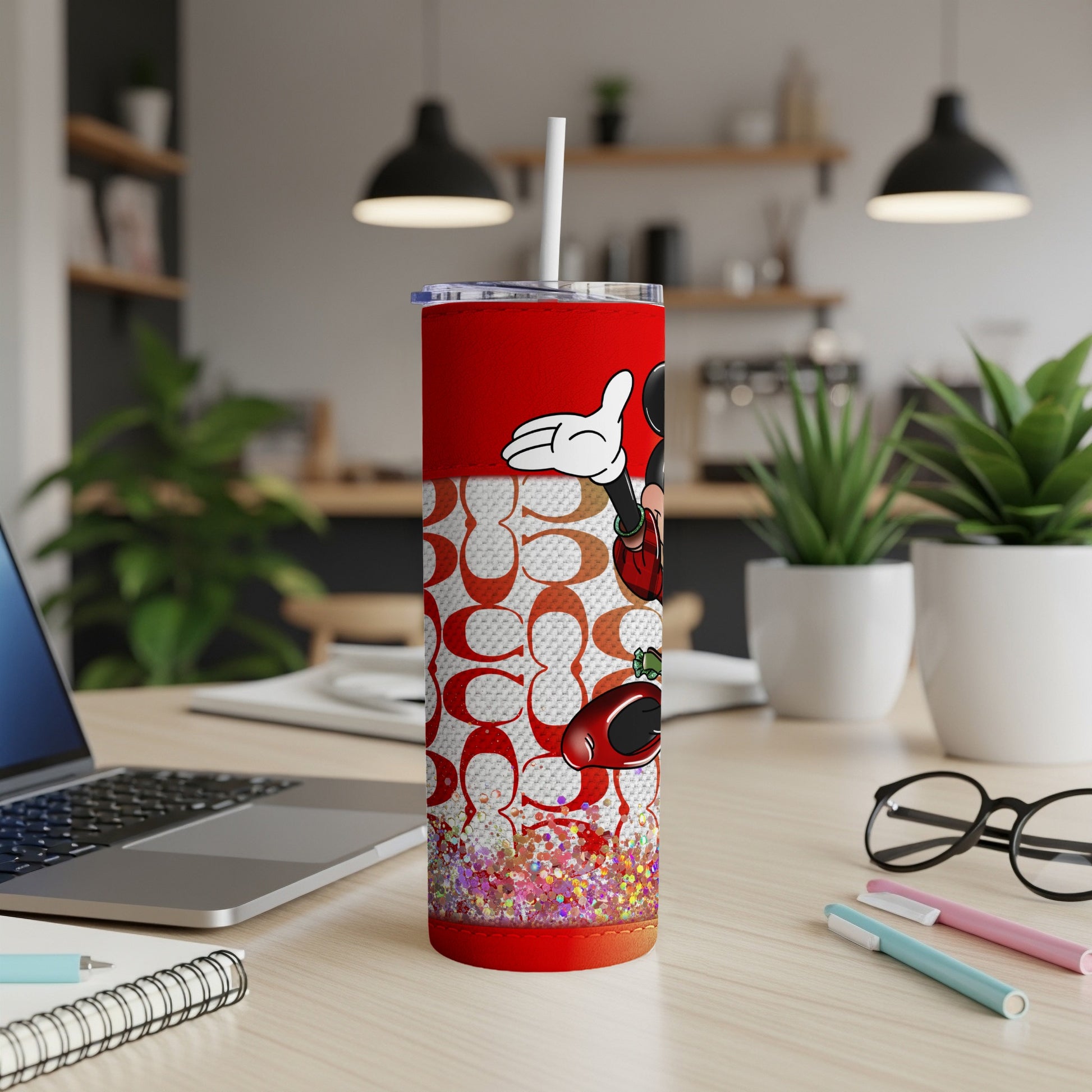 Red tumbler with Mickey Mouse and white repeating pattern.