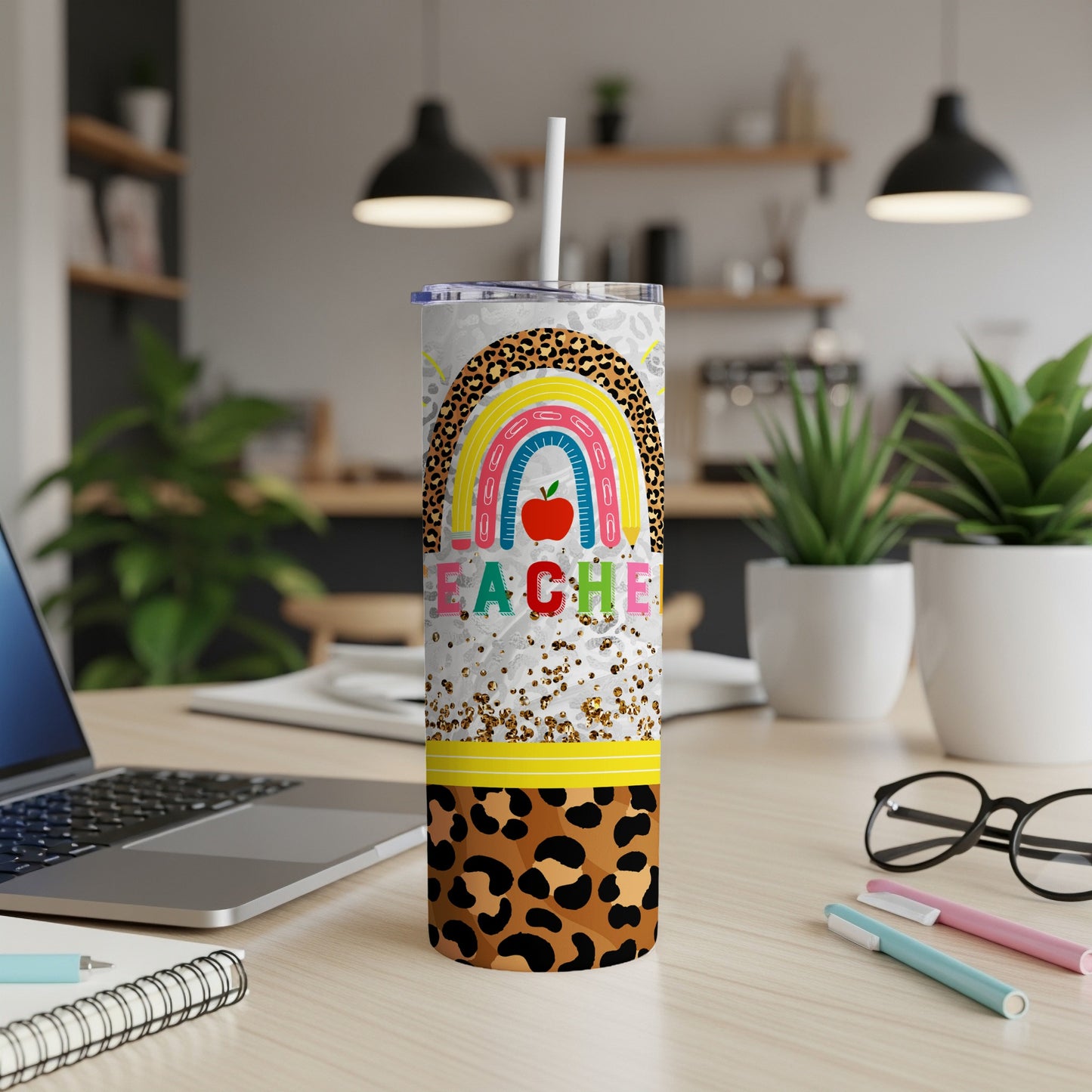 Rainbow and leopard print tumbler with "TEACHER" text.