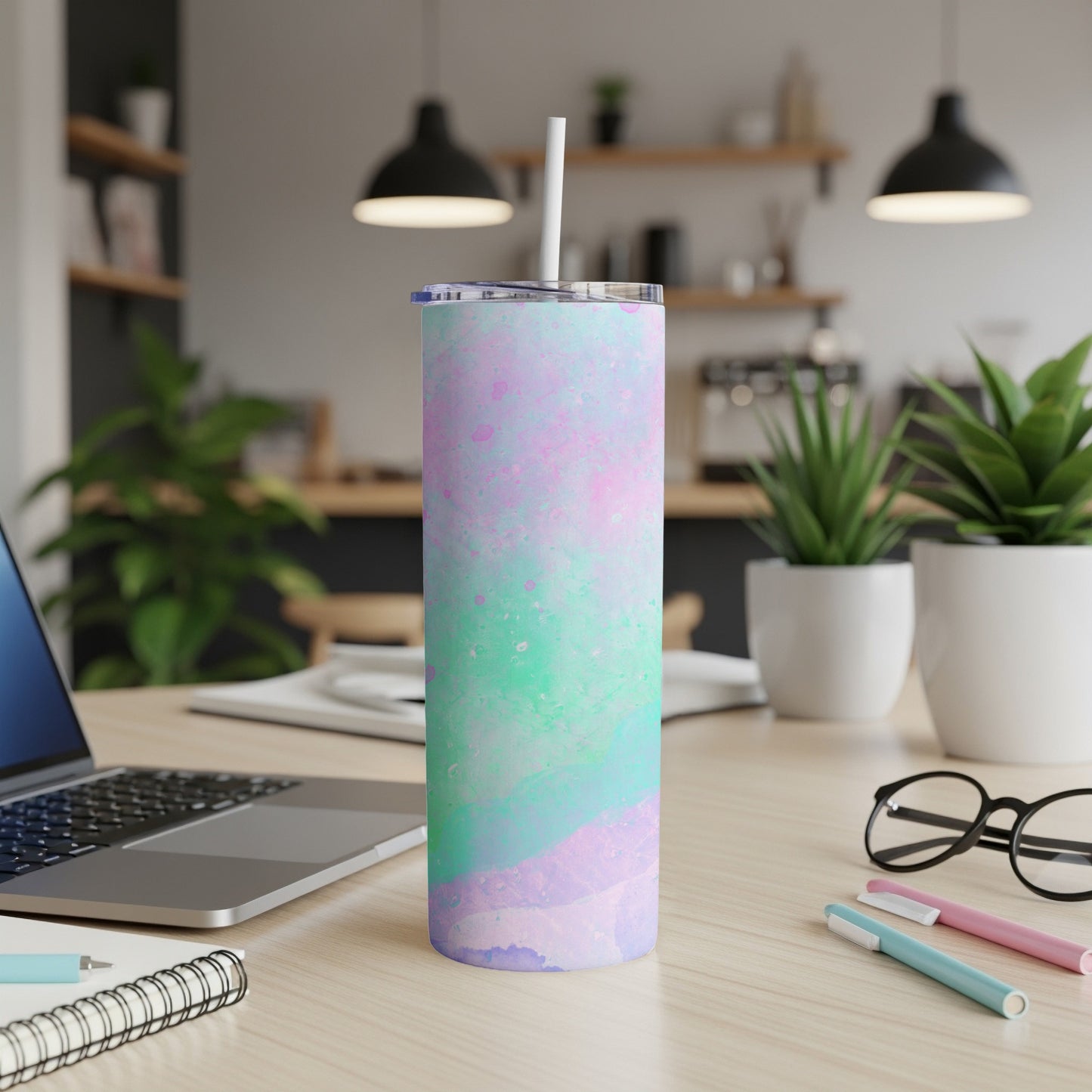 Tall tumbler with pastel watercolor-like design, white straw.