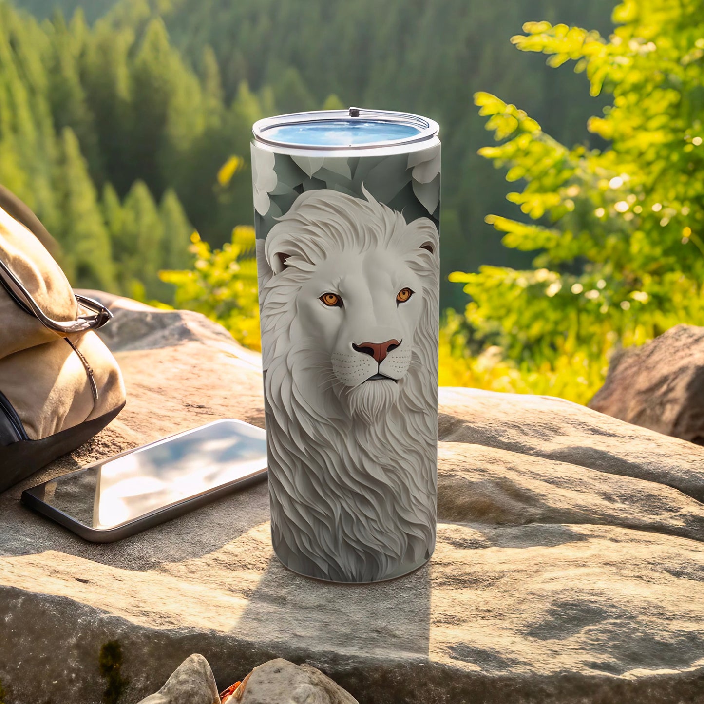 White lion's face design on a tall, metallic tumbler with outdoor background.