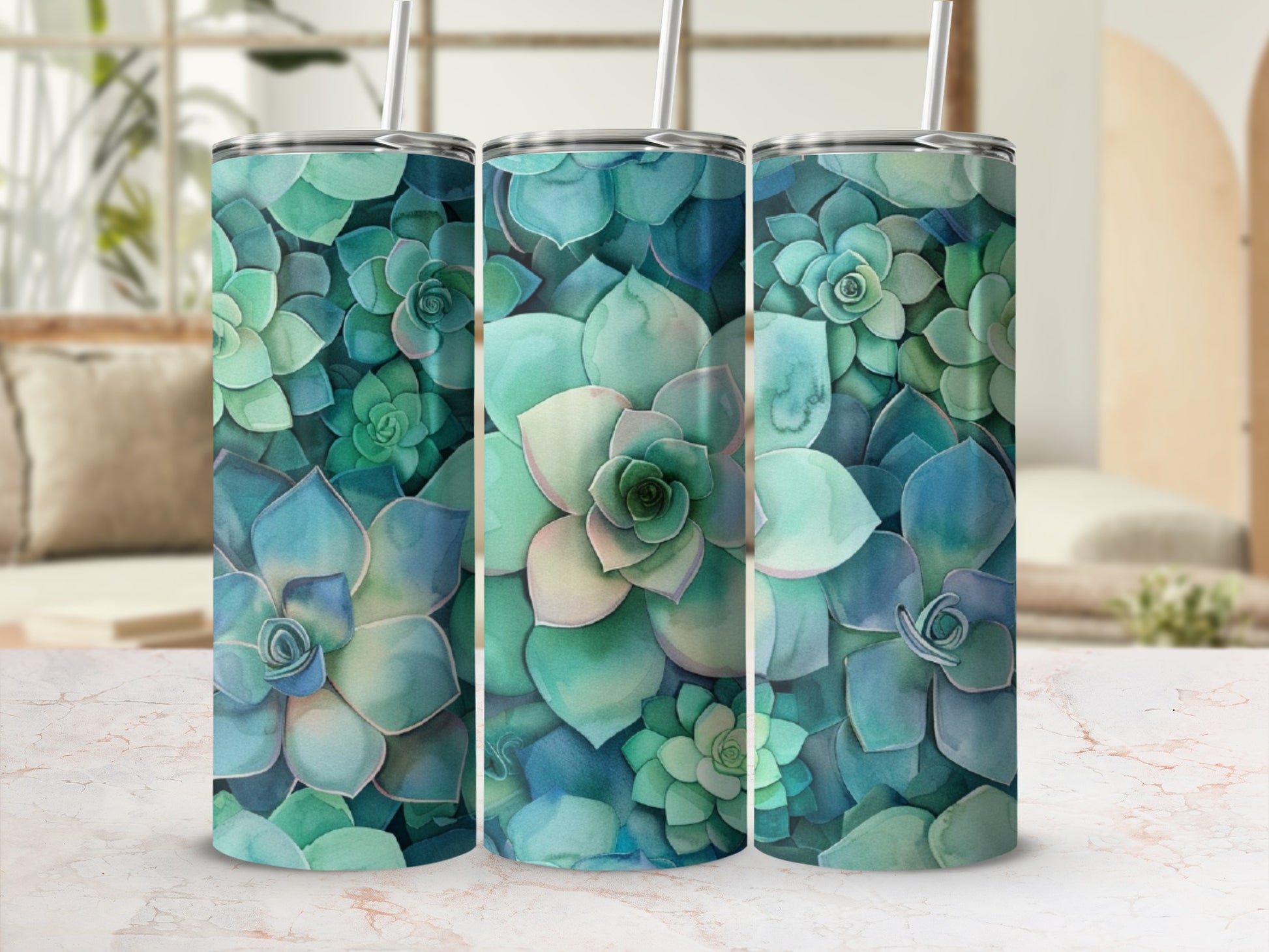 Three tumblers with a watercolor succulent pattern.