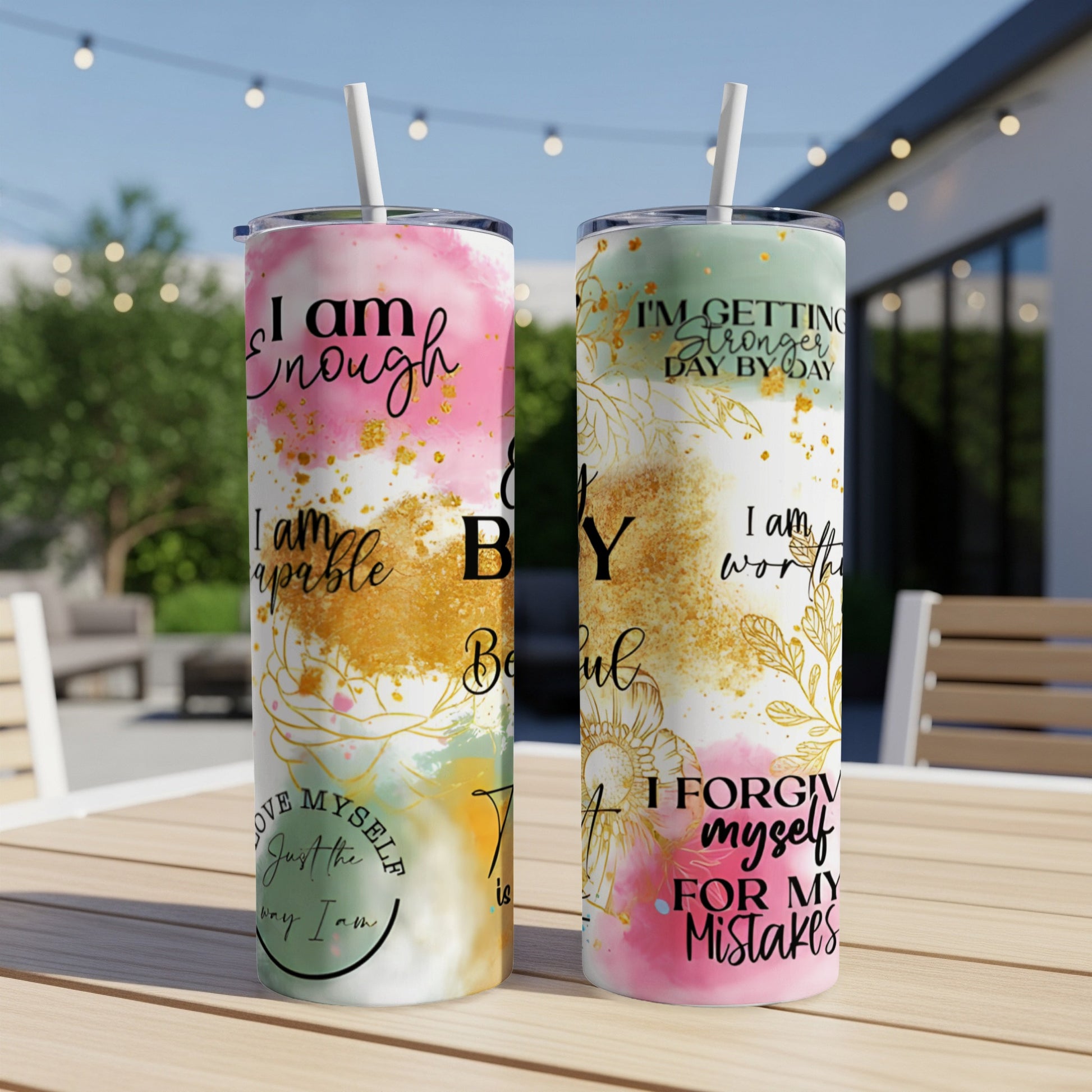 Two tumblers with inspirational quotes and colorful watercolor designs.