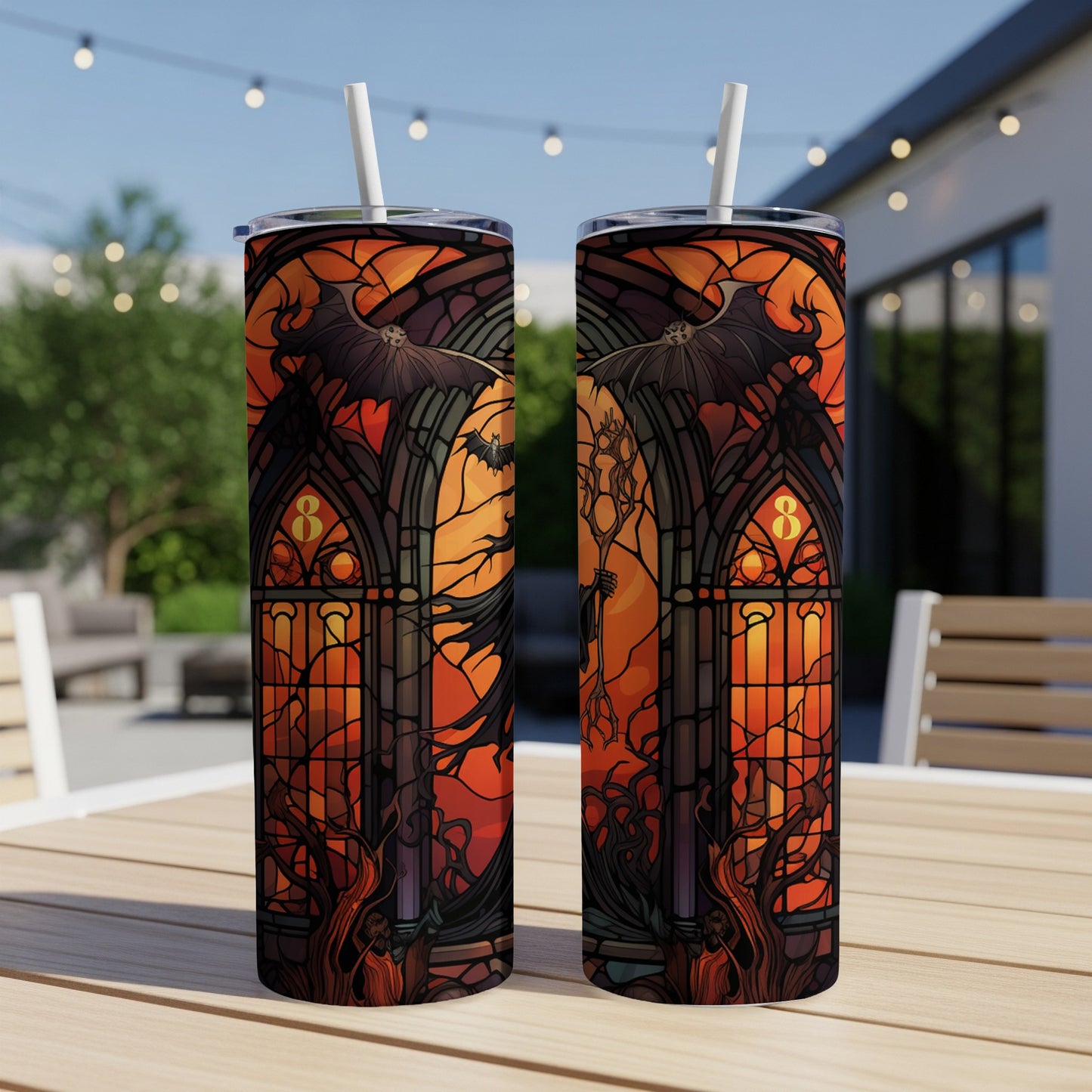 Two tumblers with a stained-glass Halloween design featuring bats and skeletal figures.