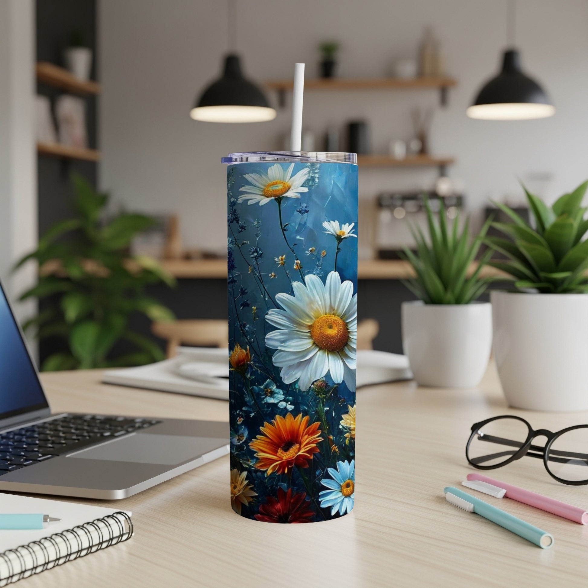 Tall tumbler with a vibrant floral design featuring daisies and wildflowers.