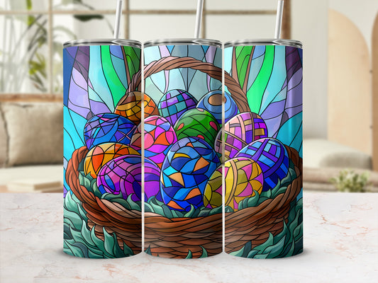 Basket of colorful, stained-glass Easter eggs with green foliage accents.