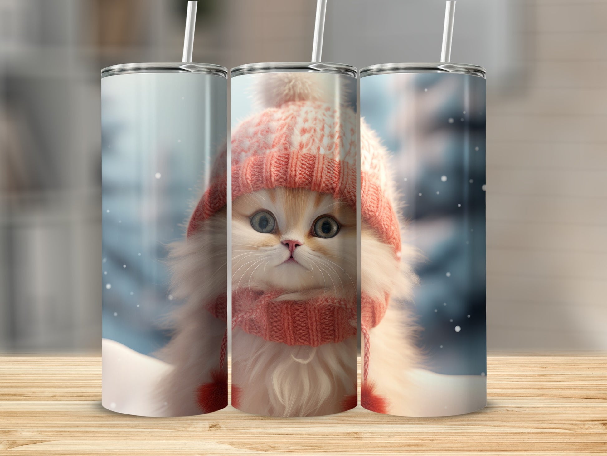 Kitten in a pink knitted hat and scarf, on a snowy background.