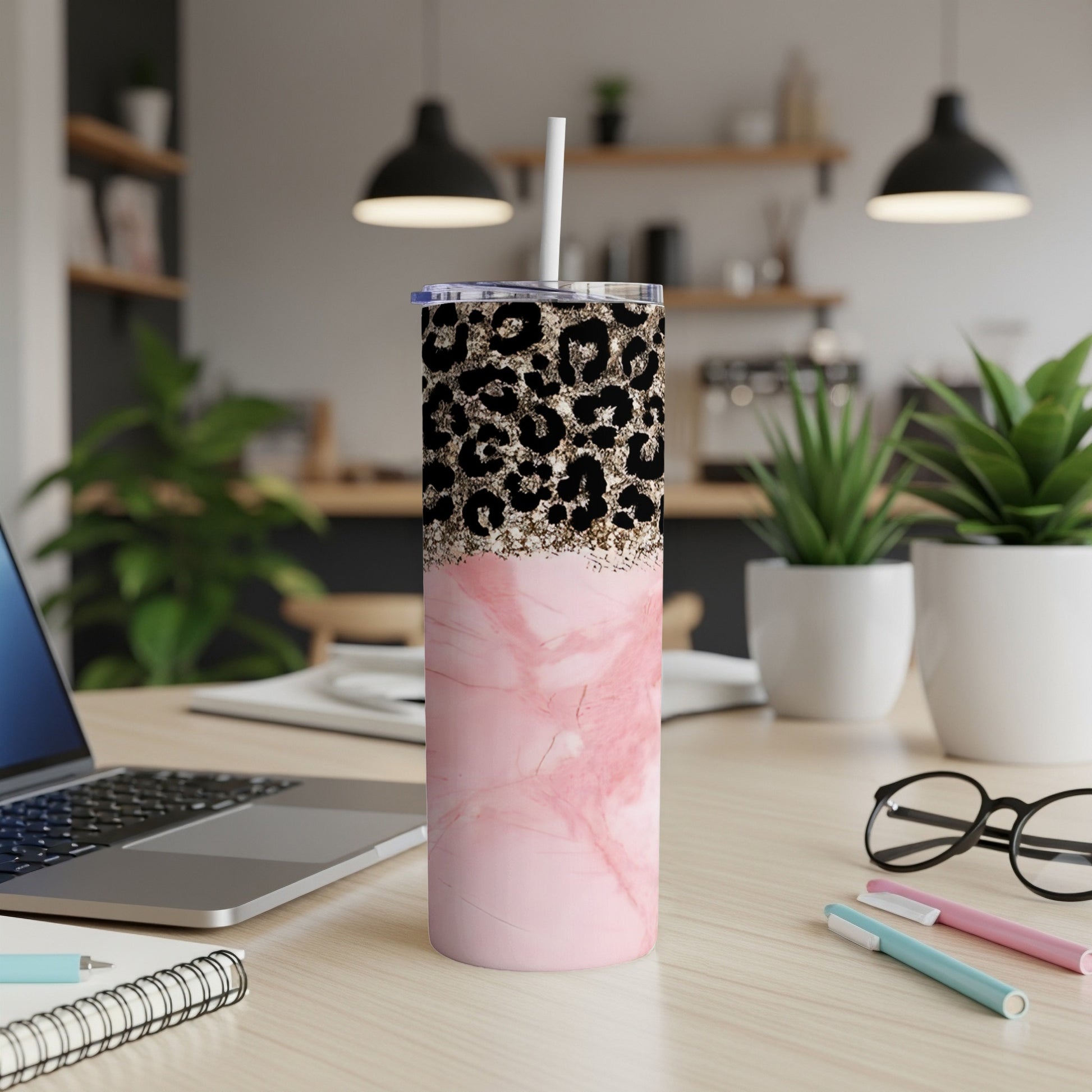 Pink marble tumbler with leopard print lid and straw.