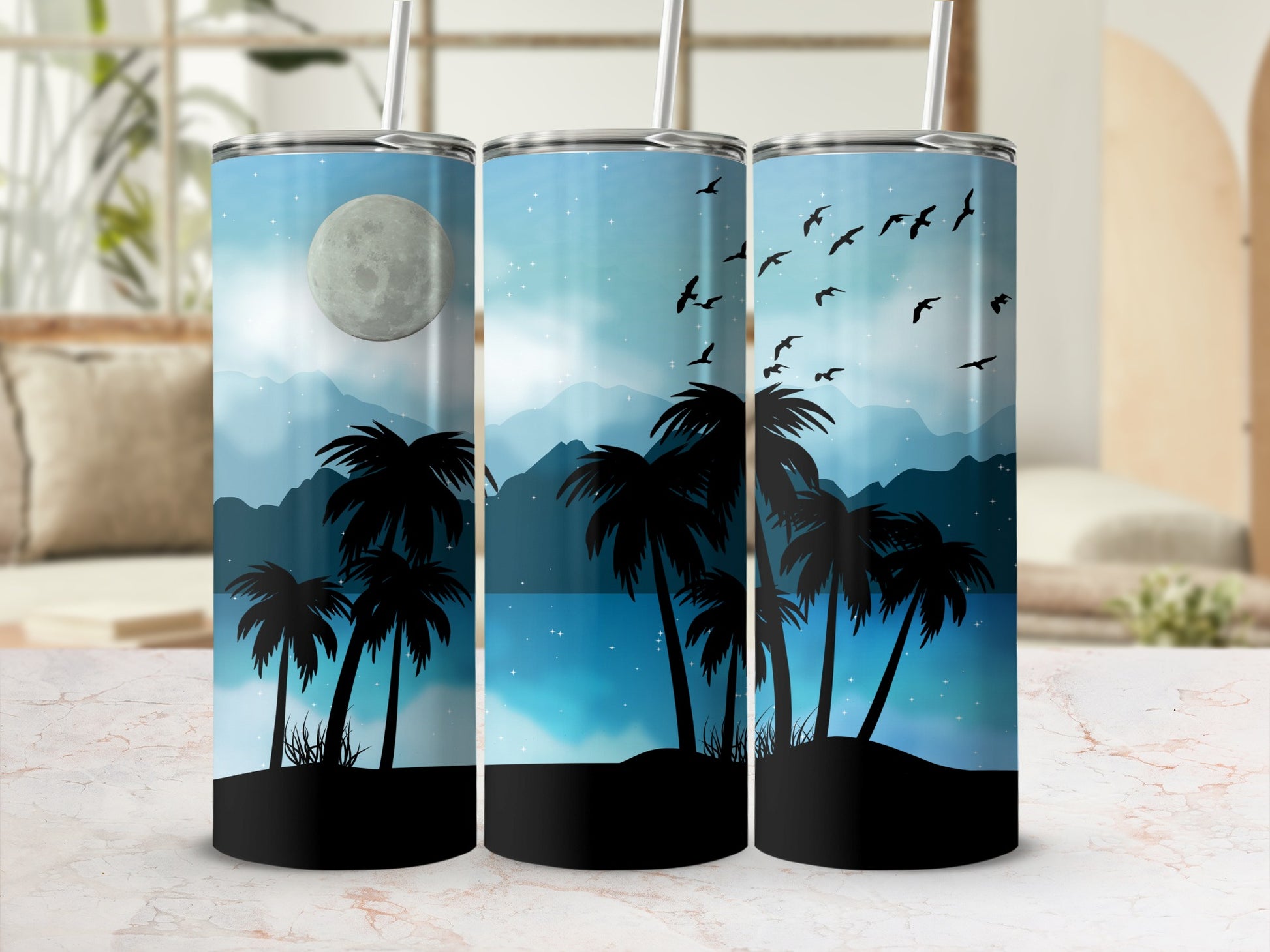 Three tumblers with a night sky, moon, palm trees, and birds design.