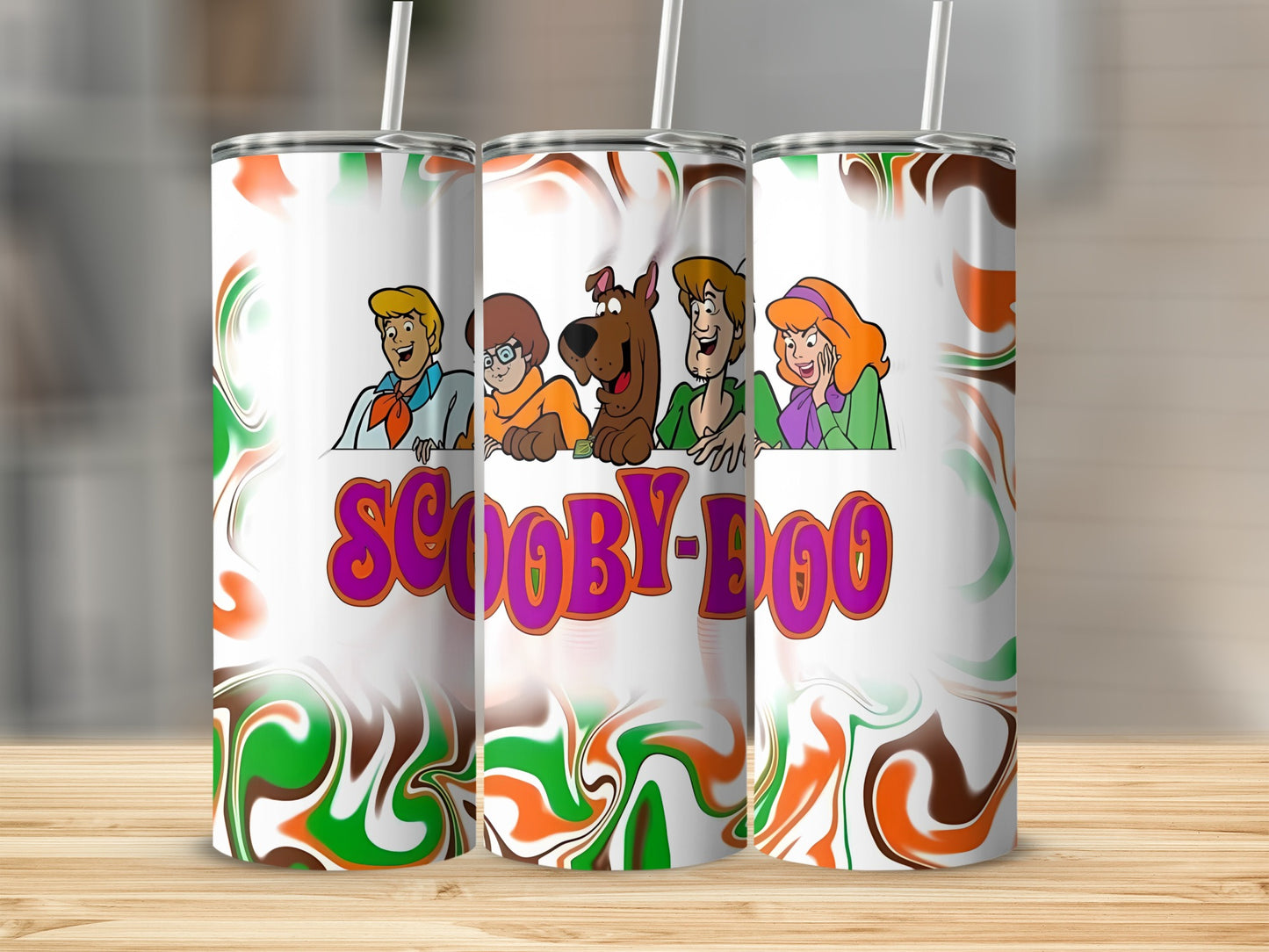 Scooby-Doo characters on a tumbler with swirling green, orange, and white pattern.