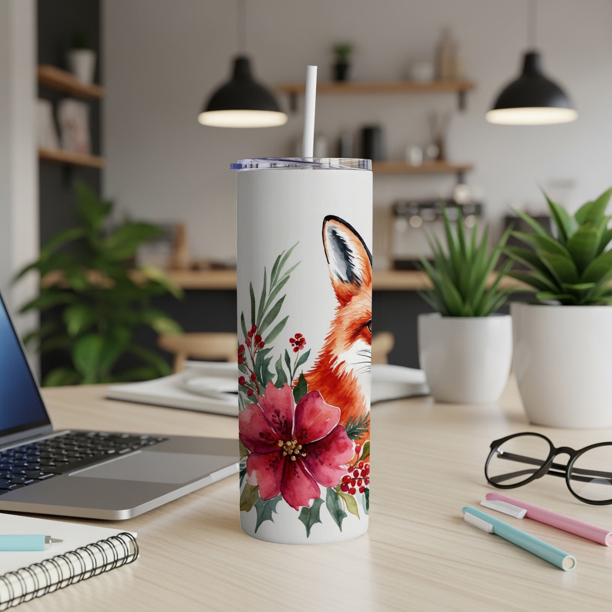 White tumbler with fox illustration, red flowers, and green leaves.