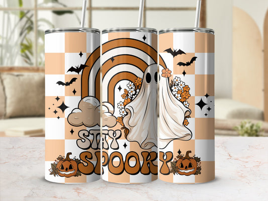 Tumblers with a ghost, rainbow, pumpkins, and "Stay Spooky" text on a checkered background.