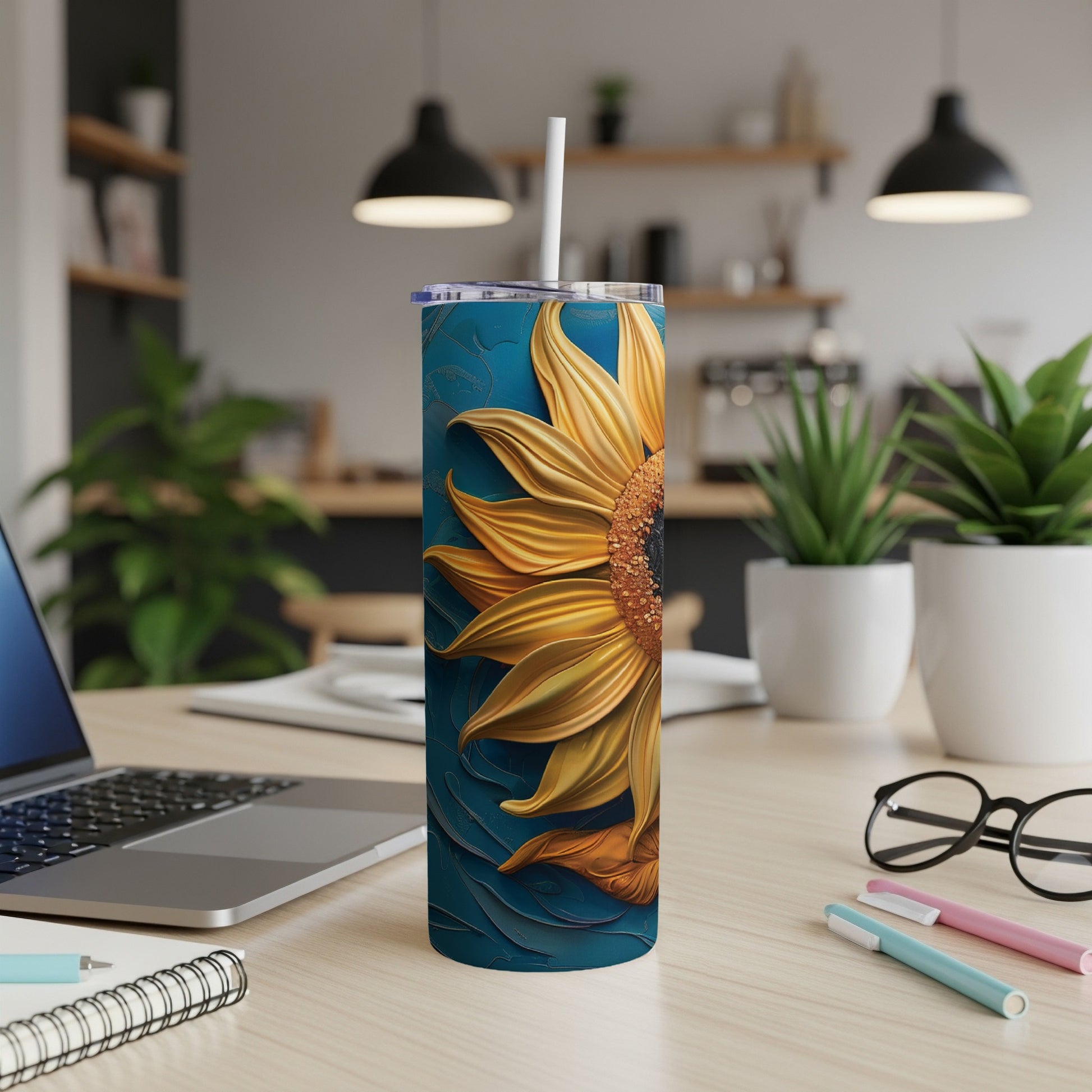 Sunflower design on a blue tumbler with a white straw.