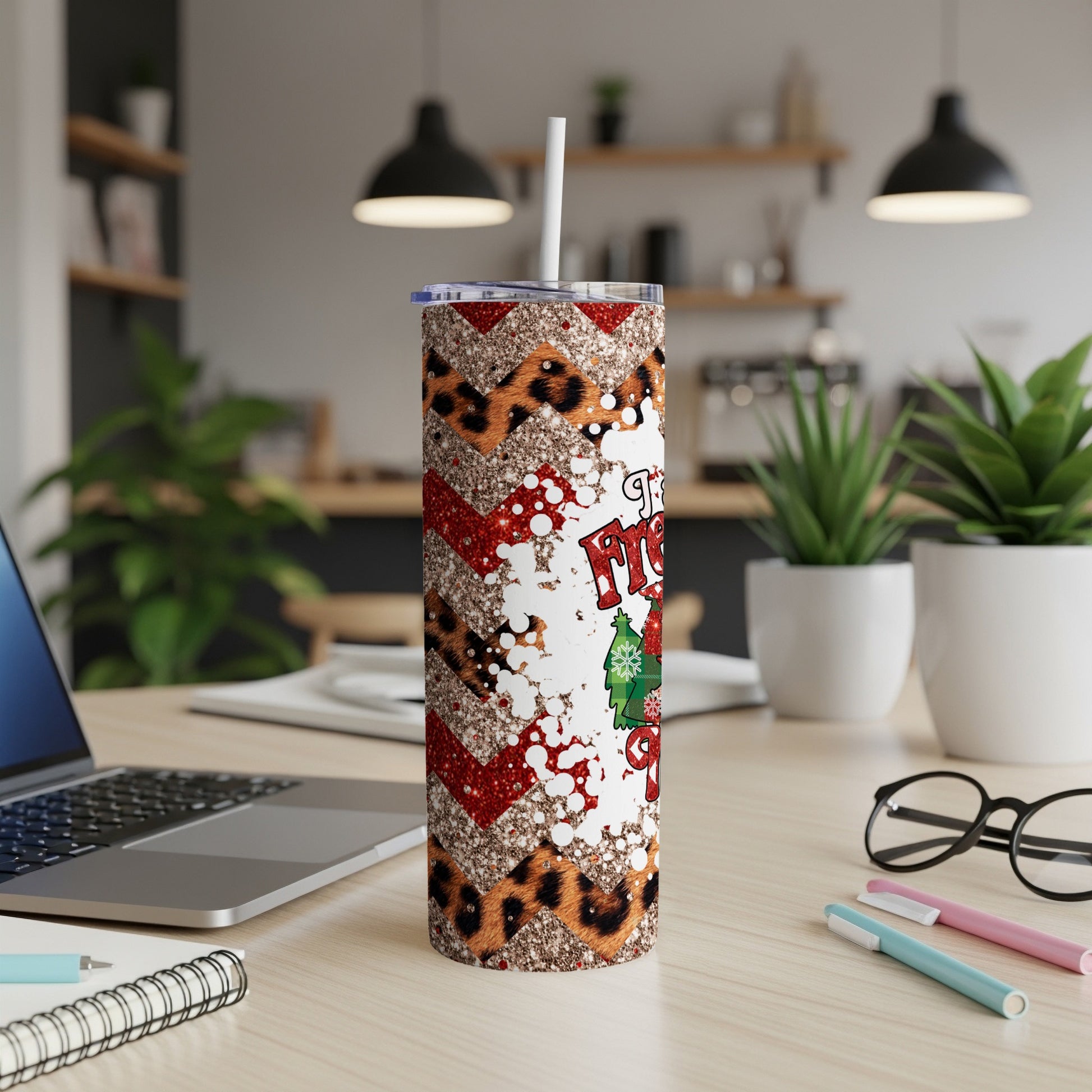 Glittery Christmas tumbler with leopard print and red chevron patterns.