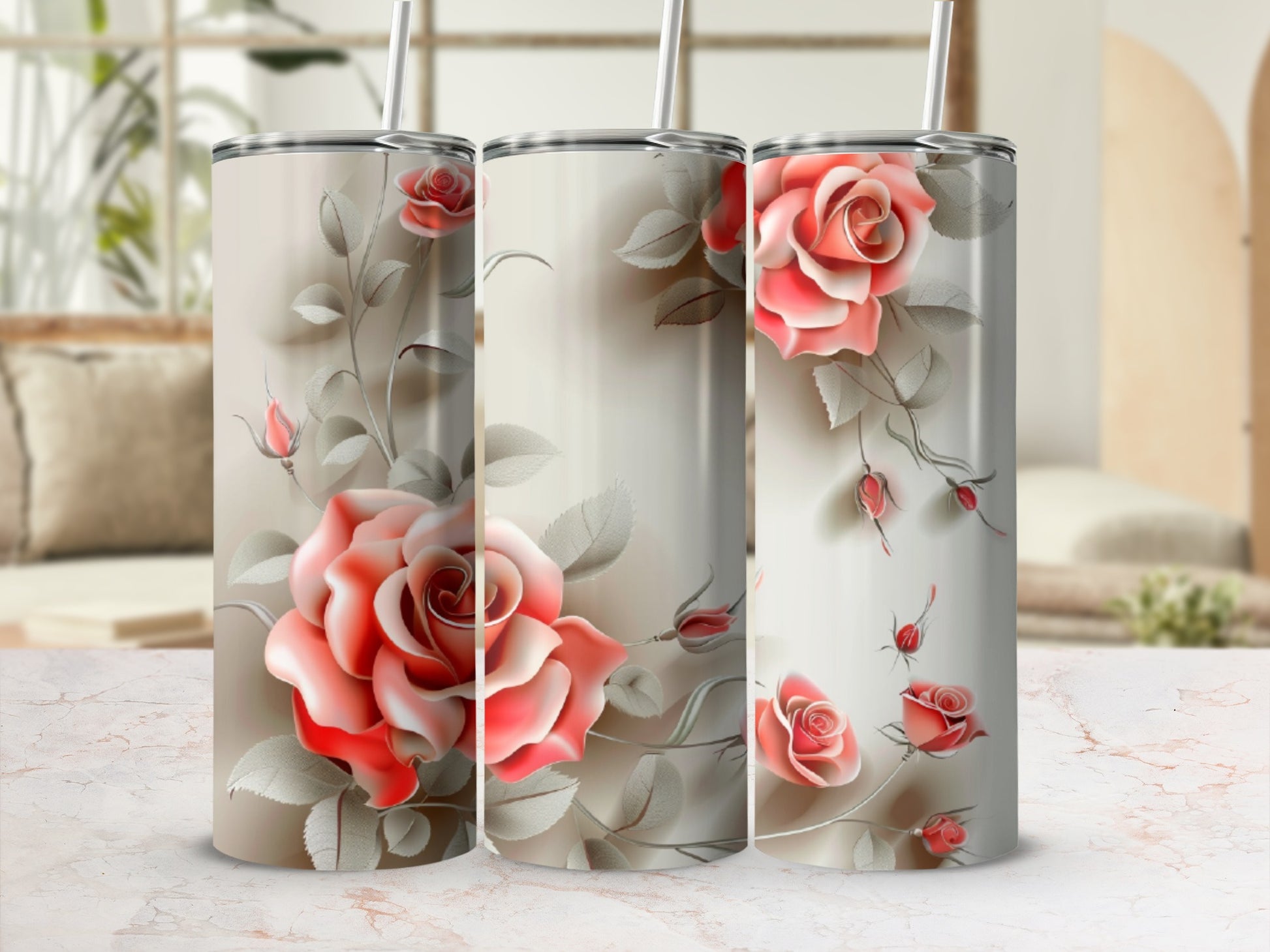 Three stainless steel tumblers with a pink rose floral design.
