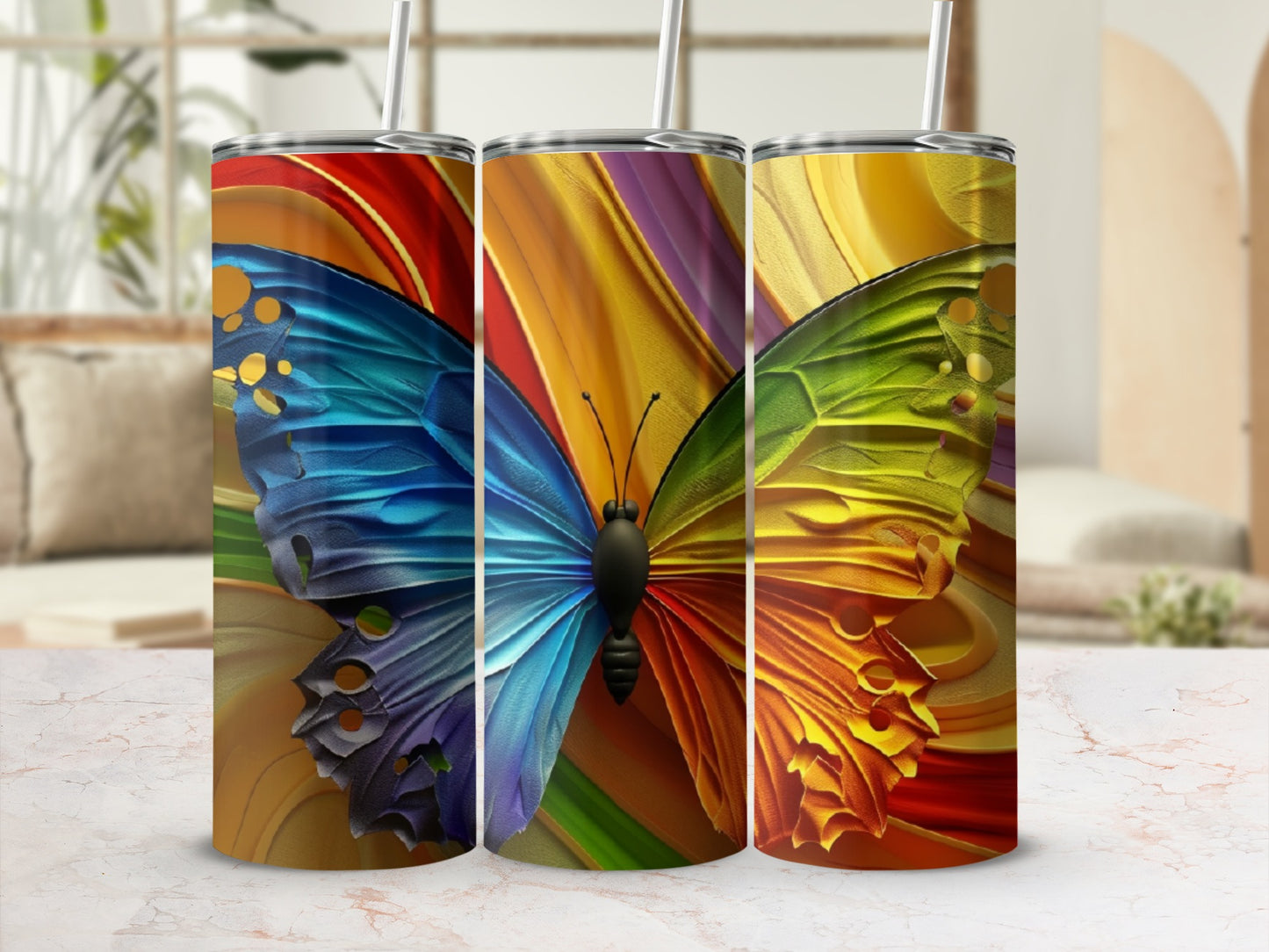 Three tumblers featuring iridescent butterfly wing designs and colorful abstract backgrounds.