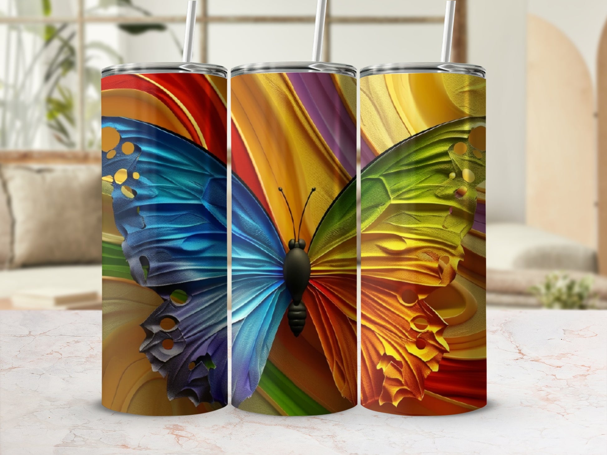 Three tumblers featuring iridescent butterfly wing designs and colorful abstract backgrounds.