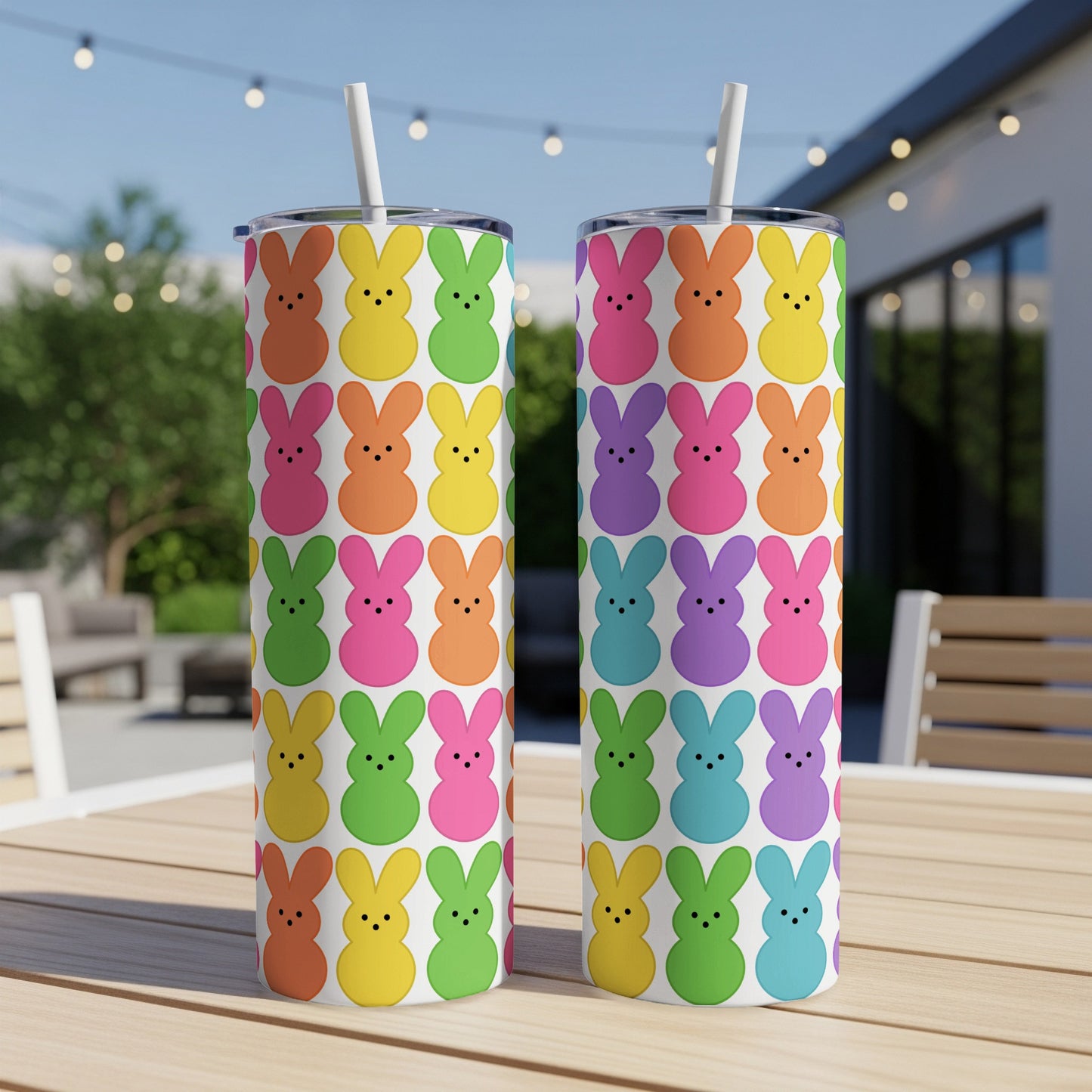Two tumblers decorated with a pattern of colorful Peeps marshmallows.