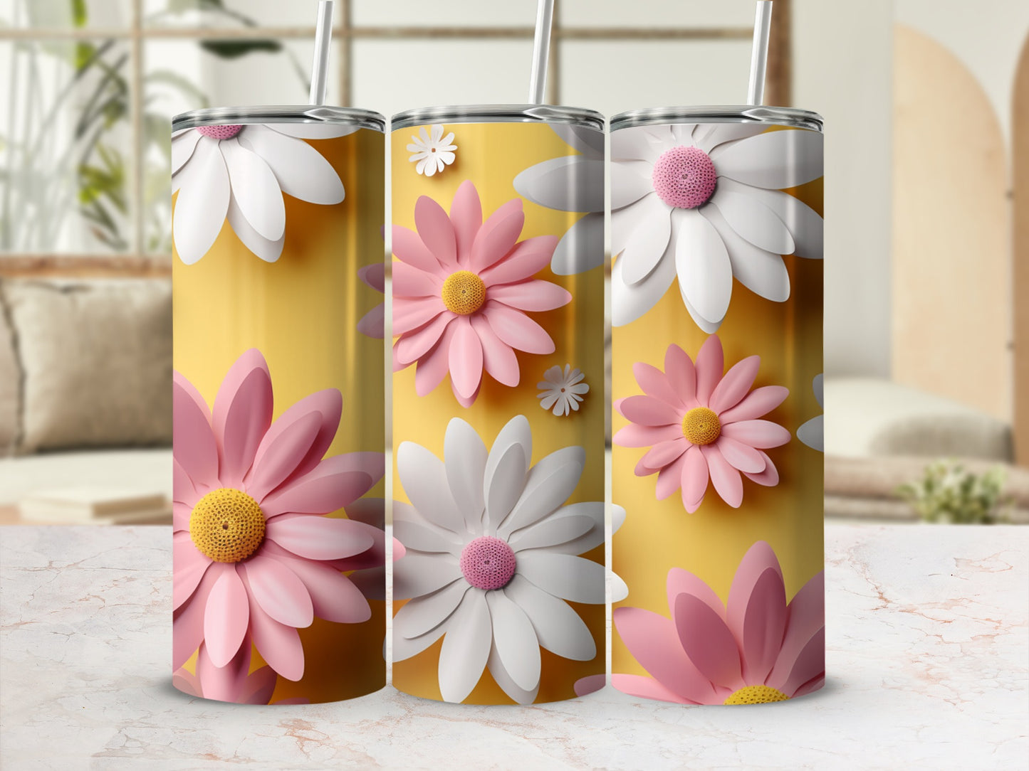 Three tumblers with pink and white flowers on a yellow background.