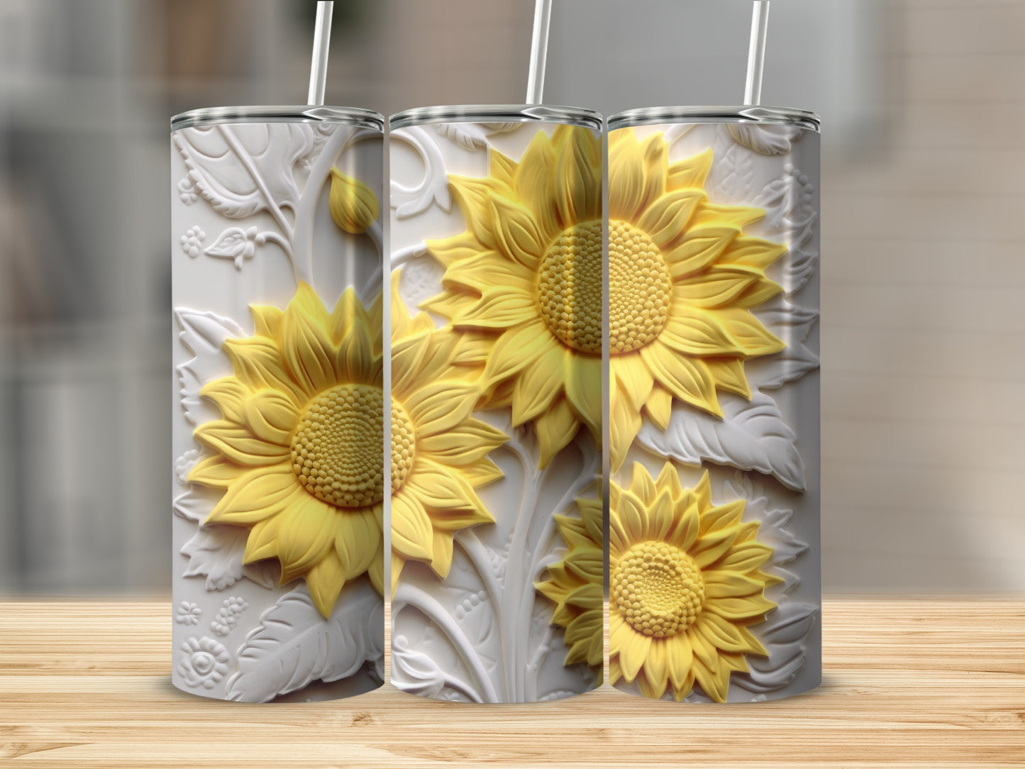 Three textured tumblers with raised sunflower designs in yellow and white.