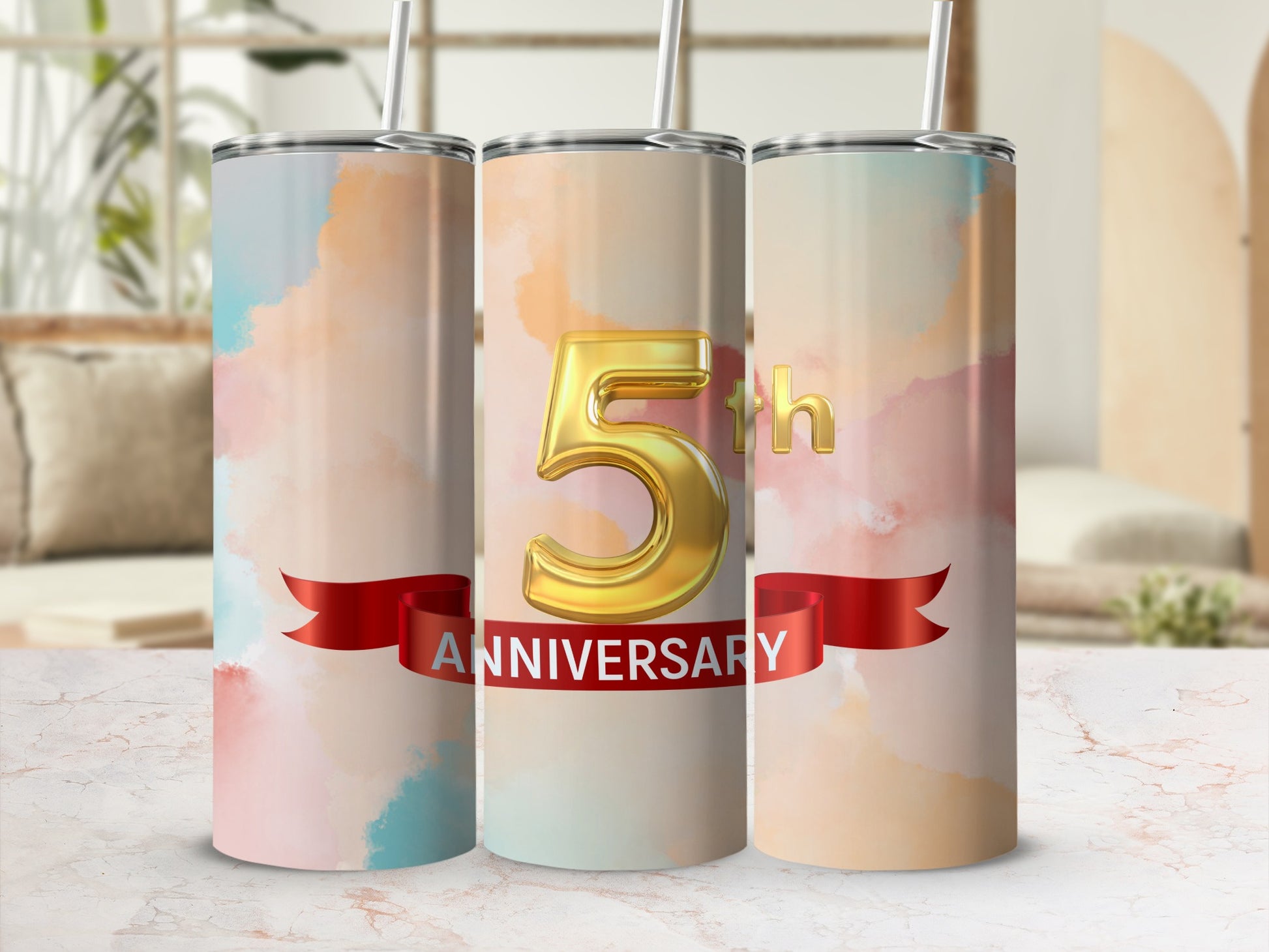 Gold "5th ANNIVERSARY" text on a watercolor gradient tumbler.