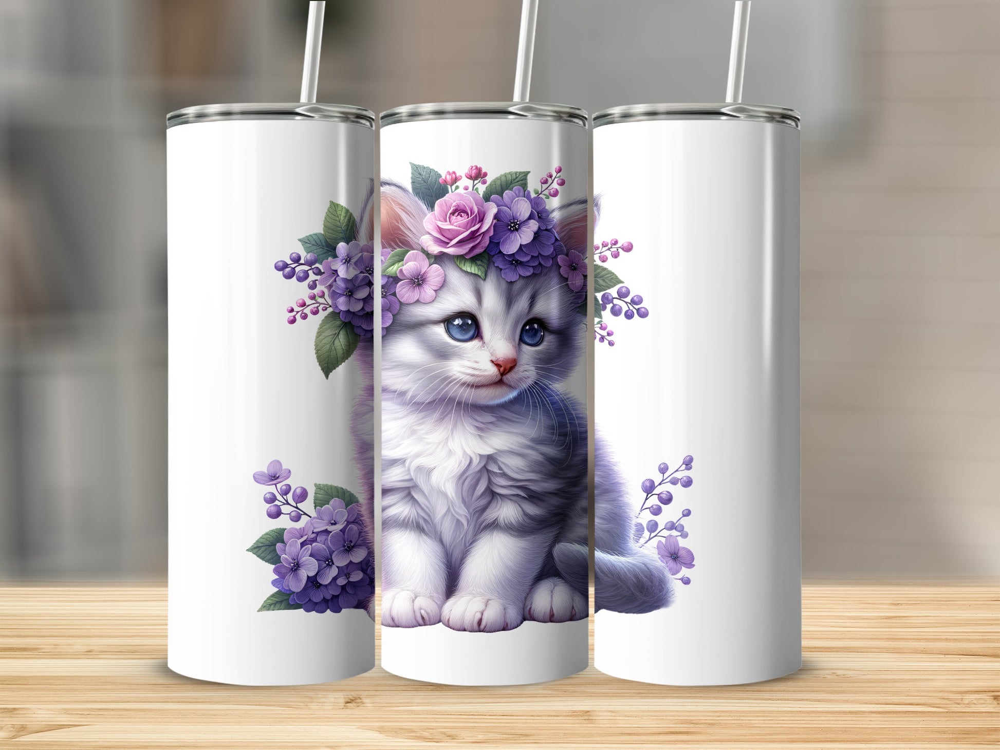 Gray kitten with floral crown on white tumbler.